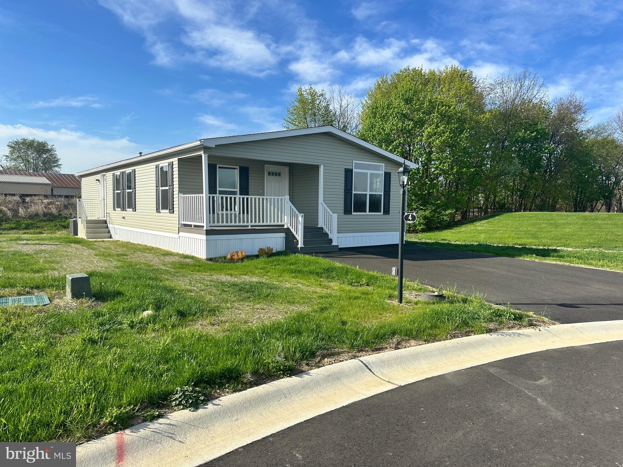 New construction, never-before-lived in, 1-floor appx. 1,343 sq. ft. 2 bed/2 bath with flex room (home office, den, sewing room, whatever you'd like!) high-end manufactured home with chef's kitchen. Set amongst other all-new homes at Shadowstone Village, centrally-located one block from Main Street in Palmyra, PA. Shadowstone Village is a master-planned 55+ community with the warmth of a friendly neighborhood and close proximity to Hershey, Harrisburg, Lancaster and Reading without any of the big-city hustle or hassles. Walkable to salons/barbers, pizza shops and restaurants on Main Street, this home features open living spaces with a feature-packed kitchen, stainless steel appliances and both a front and rear covered sitting porch with low-maintenance composite decking and vinyl railings. All (underground) public utilities, natural gas heat, high-speed connectivity and a friendly, welcoming community convenient to the region's amenities make this home one to not miss.