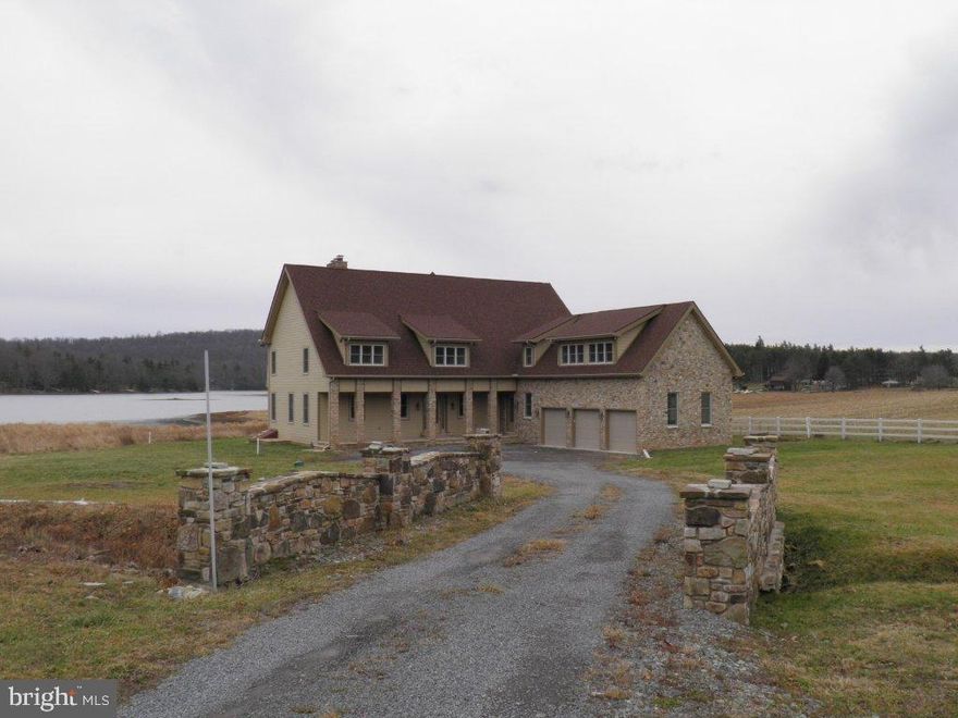 Newly Built Home located on Stilwater Cove Deep Creek Lake, inchludes one slip and accesses over a quarter mile of common shoreline with dedicated beach area. Also Stoned Patio.