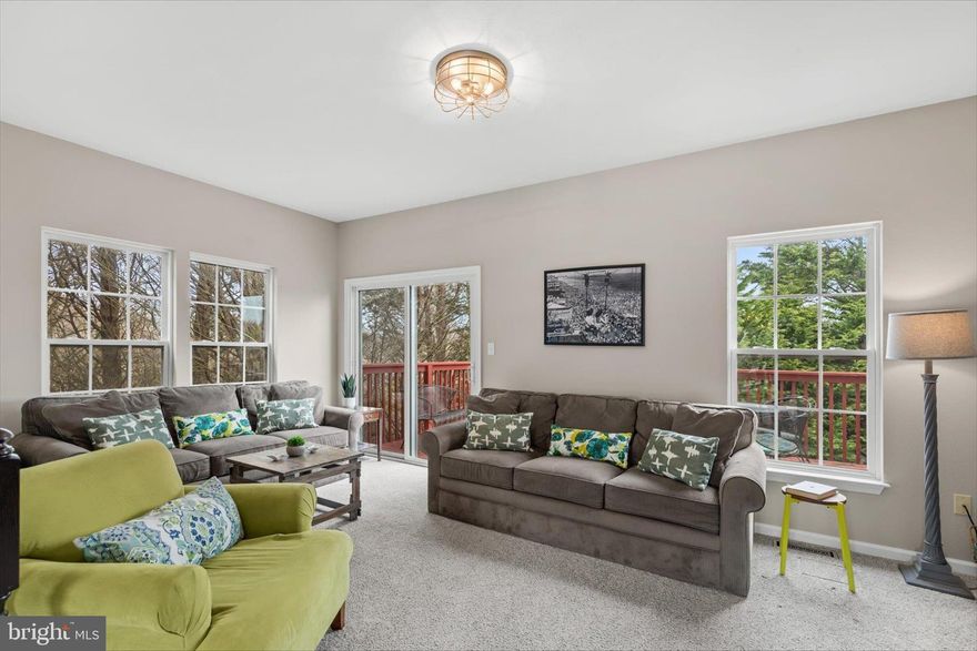 Tucked among mature trees for added privacy, this beautifully maintained three-story end-unit townhome offers a peaceful coastal retreat just minutes from the shores of Bethany Beach. Being sold furnished, this home is ready for immediate enjoyment as a personal getaway or an income-producing rental.

The first level welcomes you with two comfortable bedrooms and a full bath, along with a convenient laundry area. The rear bedroom features a private exterior door, offering easy access outdoors and added flexibility for guests.

Upstairs, the main living level is bright, open, and thoughtfully designed for gathering and relaxation. The kitchen showcases light, coastal-inspired finishes, including a striking blue glass subway tile backsplash, stainless steel appliances, a pantry, and ample workspace. The adjoining dining area is anchored by a large table, perfect for meals, entertaining, or game nights, and is surrounded by windows that extend to the floor, filling the space with natural light.

The living room provides a welcoming space to unwind, whether enjoying quiet evenings or movie nights. Sliding glass doors lead to a rear deck, where you can relax and take in the peaceful, tree-lined setting. A conveniently located half bath completes this level.

The top floor features two additional bedrooms with plush carpeting and ceiling fans. A full hall bath connects to the primary bedroom, which also includes a walk-in closet and calming views of the wooded backdrop, creating a serene retreat at the end of the day.

Located in the desirable Villas of Southampton community, residents enjoy amenities such as tennis courts and an outdoor swimming pool. With its ideal location, furnished convenience, and versatile layout, this home is perfectly suited as a beach getaway, year-round residence, or rental opportunity.