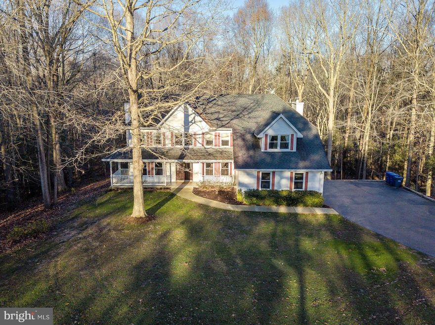 Home Sweet Home! Almost 5000 sq ft of living in this spacious colonial with so much to offer! Open kitchen with granite counters, backsplash, breakfast bar & recessed lights... overlooks family room with 1 of 3 fireplaces. Formal dining room & living room leave plenty of room for entertaining. Main level office/den off the foyer. Upper level features 4 BRS & 3 full baths. Master suite with sitting area is perfect place to relax after a long day! En suite bath with large walk in shower, separate soak tub, dual sinks & separate vanity station. HUGE walk in closet is sure to make you say wow! Lower level family room w/fireplace & full bar, and exercise room. Deck off the back gives you views of the lake. 2 outbuildings and flat level land for get togethers. Short drive to shopping, dining & more! No HOA!