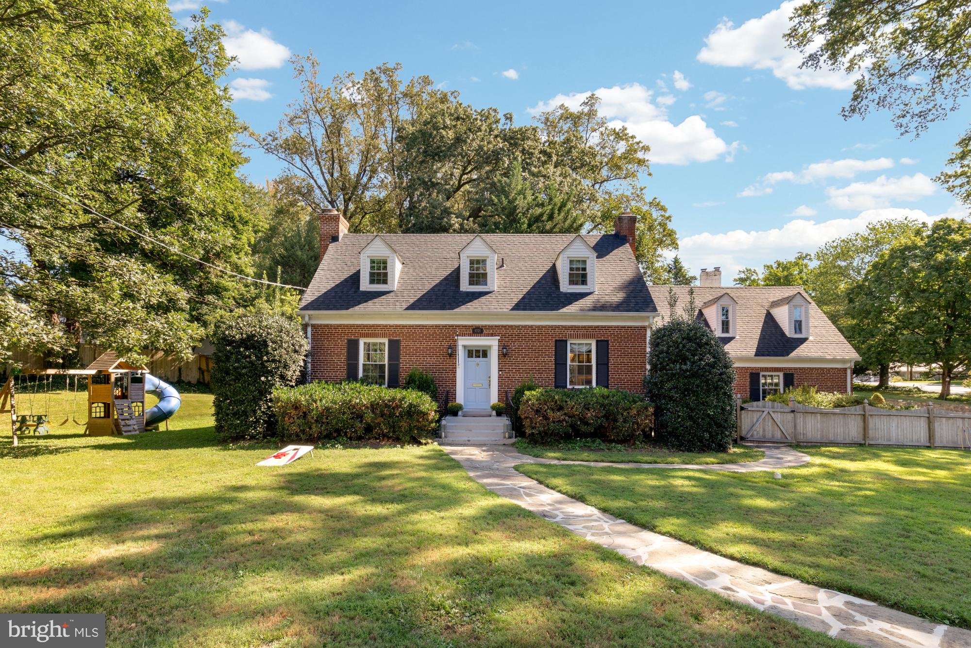 With Cape Cod charm, a lifestyle to embrace, chic and cozy, with ample space. Three finished levels, warmth fills the air, five bedrooms, five baths, comfort everywhere.
The kitchen's large, for feasts and cheer, in the living room, warmth draws near. A fireplace crackles with a gentle glow, where family and friends gather, hearts aglow.
All brick strong, outdoor spaces embrace, a playset for kids in this secure place. A lush green lawn for games to enthrall, by the fire pit 'neath trees, where dreams call.
In the back, a pond with lotus in bloom,
a fountain sings, dispelling all gloom. Terraced rock garden, courtyard so neat, grill and gather where hearts truly meet.
Nestled in a neighborhood, community warm, access to northwest, where life's joys swarm.
Easy beltway commutes, the city's flow,
if you miss this home, you'll never know!
NOT on Connecticut Avenue - The driveway for this house is located at 3921 Dunnel Lane in a peaceful and serene neighborhood. Welcome to this beautiful and charming Cape Cod style brick home on a spacious corner lot in Kensington, MD. This thoughtfully designed residence is bigger than it appears and offers 5 bedrooms and 5 bathrooms across 3,405 square feet of living space on 3 levels, set on a generous 16,860 square foot lot that is completely buffered from Connecticut Ave with trees and fencing.
Since 2022, the owners have introduced designer finishes, elegant upgrades and storage solutions, a new water heater, and an electric vehicle charging station enhancing the home's charm and functionality. Experience the refined blend of style and practicality at 9701 Connecticut Avenue—a home perfectly tailored for modern living and varied lifestyle needs.
Situated just off Connecticut Avenue near Kensington’s Antique Row, the Saturday morning Farmers Market, Rock Creek Park’s hiking and biking trails, schools, shopping and entertainment venues and more! A commuter’s dream with close proximity to the Metro, the Marc Train, the Capital Beltway, downtown Bethesda, Chevy Chase and Washington, DC. Book your showing today!