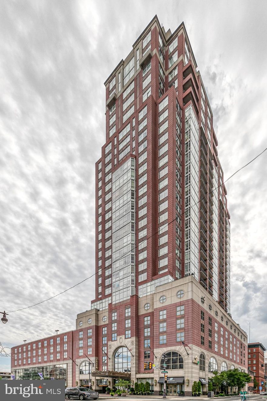 Mozart Luxury Suite in the spectacular Symphony House! Incredible opportunity to purchase this sun-filled, 2395 sq ft, 2 bedroom, den, 2.5 bath condominium with balcony, 2 car parking, 2 storage spaces, dramatic east and south views, crown molding throughout, electric window blinds, main bedroom suite with 4 piece bath and two huge walk in closets with built-ins. This property is two units combined into one and has incredible sunrise and sunset views.  Enter into foyer area with wood flooring, coat closet and double closet with full sized, front load Bosch washer and dryer, plus additional storage and half bath with pedestal sink. Bedroom suite with large window, carpeting, southern view, linen closet, walk in closet and full tile bath, stall shower with glass enclosure and double vanity.  Handsome, fully equipped kitchen with wood flooring, granite bar counter, recessed lighting,  stainless steel Viking 6-burner stove and appliances, wine cooler, eye level oven and microwave, large dining area with floor to ceiling window and door to balcony with big, southern sky view! Light filled, wide open living, dining area, kitchen area with wood floors, cabinetry and entertainment area. Spacious den with floor to ceiling window and wood floors. Unusually expansive main bedroom suite features carpeting, floor to ceiling windows, two huge walk in closets with built in shelving and cabinetry, four piece tile bath with double vanity and stall shower. Additional access door to hallway. The Symphony House offers a 24/7 concierge, doorman, fitness center, bike share, incredible heated indoor pool and sauna, pristine outdoor spaces, library, club, dining salons, wine cellar and a catering facility. Nestled in a prime and convenient Avenue of the Arts location close to the theatre district, fine restaurants, shops, cafes and more! Parking #: 569 & 570Storage #: L70 & L71