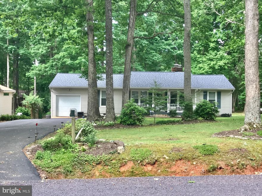 Enjoy life in this wonderful lake/gated community! W/ golf, tennis, pools, gym & equestrian center. Near shops & restaurants. 4 bedrm,  4th=office! 2 baths! 2 gas fireplaces! HUGE Great room w/ dining rm & lovely sunroom to enjoy private treed back yard. All on one level! Level back yard w/ grass.Fire pit chat area & lovely front porch, Deck, shed & Extra wide driveway! You will love it!