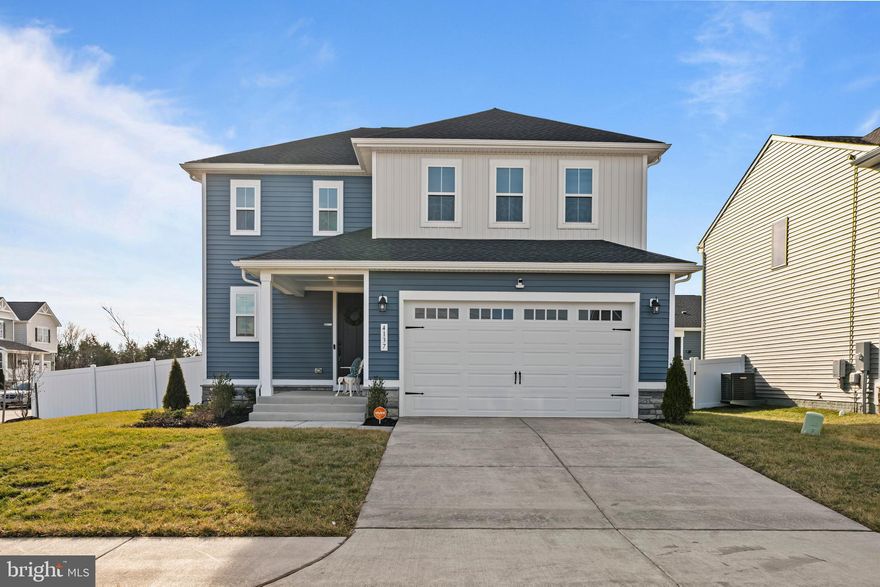 Immaculate one year old home full of owner upgrades!  This Coral model in popular Foxhaven community has all the bells and whistles.
Enjoy the clean look of white kitchen cabinets with custom pull out drawers, white quartz counters and beautiful white herringbone pattern tile backsplash.  New upgraded Stainless steel appliances include a Cafe Elect duel fuel range (seller installed a buried 150 gallon propane tank for gas cooking), a Fisher & Paykel drawer dishwasher and the trendy Samsung Bespoke counter depth French door refrigerator with dual filtered water dispersal. A whole house water softener and reverse osmosis kitchen filter offer top of the line water quality. All three finished levels  boast a durable yet attractive warm honey colored luxury vinyl, including both staircases, that goes with any style and decor. Upstairs you'll find a generous sized primary bedroom suite with an attractively decorated private bath, plus a hall bath for the two large secondary bedrooms.  Relax in privacy in the upper loft or use  for an office or homework area away from the hustle and bustle of the kitchen. Laundry room conveniently located on bedroom level with new front load washer and dryer.  The fully finished basement offers a rec room area, storage and a 4th bedroom with a beautiful tiled full bathroom. 

Step outside onto the maintenance free composite deck to enjoy a large yard fully fenced with attractive and also maintenance free vinyl fencing. * Other convenient upgrades include Vivint smart security system including 3 exterior and one interior cameras * One-way UV protected rear windows, allowing you to see outside, but stops others from seeing in during the day * Second electrical panel added for finished basement * White window blinds throughout * Gladiator storage in garage * fresh paint throughout * Ceiling fans in all bedrooms and family room 

Simply move in and enjoy!