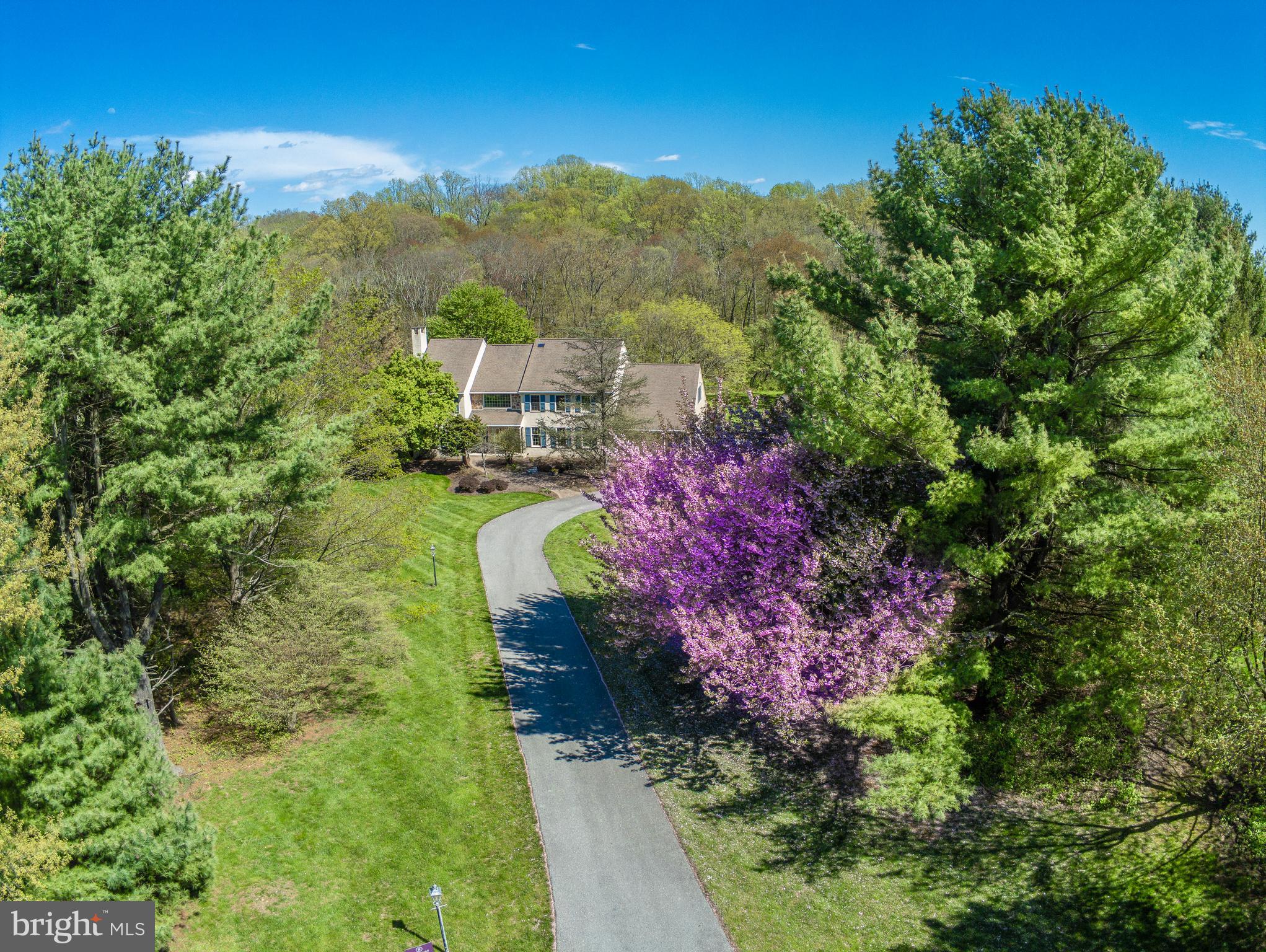 7 Jorrocks Lane is in a storybook setting, at the end of a cul de sac in the heart of Willistown! This lovely home is located on 4.3 acres, and is adjacent to wooded open space .The interior features a soaring cathedral ceiling with natural light that infuses the hallway. There is a powder room in the front hallway. The open floor plan has a great room, with fireplace, and large family room with a stone hearth and fireplace perfect for cozy gatherings. Enjoy a generous screened in porch off the family room on warm summer evenings. The sunlit kitchen has a large island, with granite counter tops and cherry cabinets, and a breakfast area. There is a shelved walk in pantry and mudroom/laundry area that leads to a 3 car garage, there is also a separate detached 1 car garage with extra storage!Upstairs, the main bedroom suite has abundant space, and built in bookshelves. There is a linen closet, "his and hers " full baths, and two walk in closets .Down the hallway are another linen closet and three additional large bedrooms, one en suite full bath, and another full hallway bathroom. There is an additional storage closet in the 4th bedroom. The lower level offers a full unfinished basement, with plenty of storage space. Outside, there is an over sized deck to enjoy serene vistas right outside your door! This home is in Radnor Hunt country, and riding enthusiasts may have a horse at this location with trails nearby. It is also close to schools, EA Academy, convenient to Paoli and shopping. This home will be cherished by its new owners for years to come! Seller is willing to offer virtual showings through FaceTime, Contact Listing Agent for more details! Virtual showings at this time.