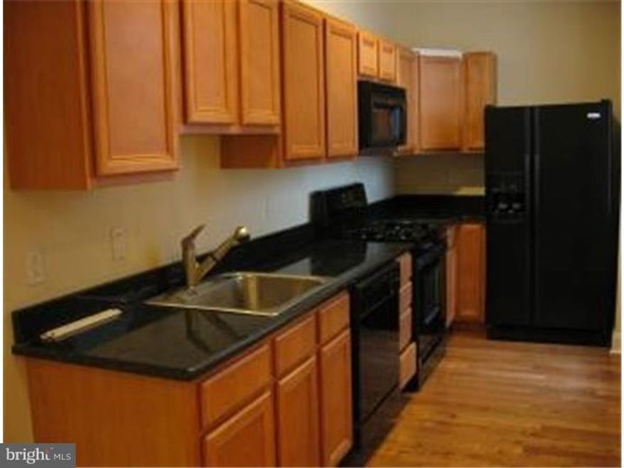 Beautifully renovated modern apartment in the heart of Northern Liberties. Feel at home as soon as you walk in on the wall to wall HW floors, recessed lighting, maple kitchen w/granite counter tops, and all black appliances.  Safe and secured building with approximately 50 units.  Enjoy the 2 level 2 roof deck, gym, free coffee and tea in the lobby. Parking included, outdoor parking lot space is limited but very accessible -daily. Plenty of street parking around perimeter of building on 3rd and Cambridge St, no city parking permit necessary.  Pet Friendly, Includes all appliances. Secure entry with key code access and Intercom.  Only 1 block from then Piazza and steps away from all local entertainment, food, and shopping. Lease Terms - Available September 16th, Total Move-In Cost $3,500 1 Month Security Deposit + 1st Month's Rent and Pet Deposit $250 (if applicable) Utilities are as follows: Landlord responsible for - trash, water, & sewer. Tenant is responsible for - gas & electric.  Gas heat and central a/c.  Common area space available - Roof, Fitness room, & Lobby. Professional Management with 24/7 Maintenance on Staff.