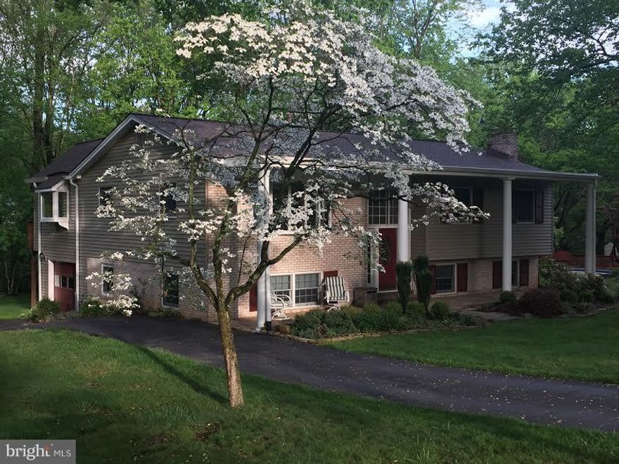 Back on market due to buyer financing. 2800 total sq footage. Ideal location,1 block to elementary & high school, Metro bus on corner. Almost 1/2 acre. Beautiful stone walkway added 2016. UL family room & breakfast room overlook a lovely lot w/mature trees. Second master LL, upgraded baths, hdwd floors,Next Day blinds. Extra deep garage, LL walkout. 2 storage rooms,1 w/workbench. Roof  2012.