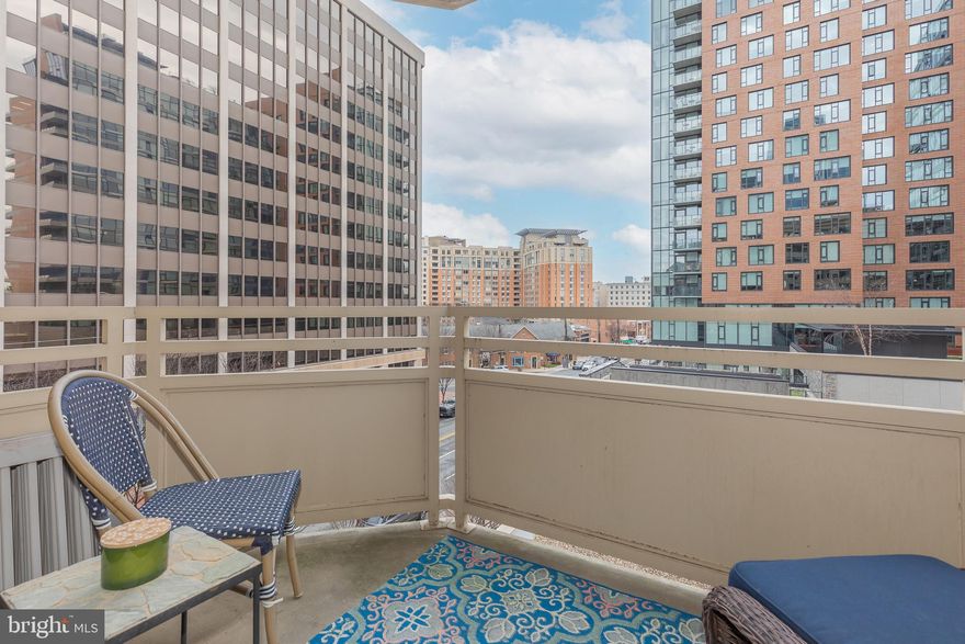 Welcome to this sun-filled one-bedroom, one-bath corner ​unit condo featuring an in-unit washer/dryer, ideally located in the heart of downtown Bethesda.​ As you enter, the​ freshly painted living room​ with designer finishes flows seamlessly into the kitchen​—perfect for both everyday living and entertaining. Natural light pours in through sliding glass doors that lead to a private balcony overlooking Woodmont Avenue and the Bethesda skyline. Enjoy your morning coffee or unwind in the evening while taking in city views​. The spacious bedroom ​features expansive windows on two walls with a walk-in closet and a custom-built window bench—perfect for reading or relaxing. A generously sized bathroom and ​multiple storage closets provide both comfort and functionality.​ Step outside and you’re immediately immersed in the best of downtown living. Located just seconds from premier dining, ​s​hops, parks, and fitness studios — with Trader Joe’s next door and Starbucks​ and Jettie's directly across the street — daily errands and morning coffee runs are effortless.​ The Capital Crescent Trail, Bethesda Row, and the Bethesda Metro are all just a short stroll away.​ This pet-friendly building ​​offers secure entry, elevator access, professional management, and resident conveniences designed for easy urban living.​ An on-site property maintenance technician is available for small tasks such as updating light fixtures & free paint touch-ups after move-in. Garage parking is available for rent. Don’t miss this opportunity to live in one of Bethesda’s most sought-after locations!