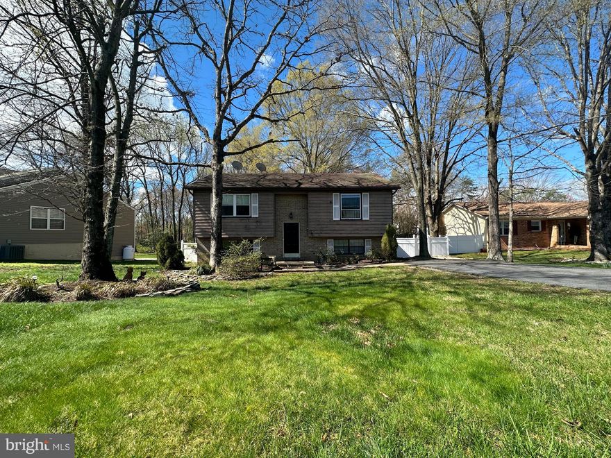 Large, flat lot with mature trees and a paved double wide driveway with room for 4 or more cars! There is a large fenced backyard yard with a pergola, swing, and small shed!  This home is in a well-kept neighborhood with no HOA!    A central location in Fredericksburg minutes from stores, battlefields, wineries and more! 
 The home itself needs some work, but has potential for sweat equity for the right buyer!  Could be easily converted into a 4 bedroom with the egress window in the basement .  The home will be sold in as-is condition.