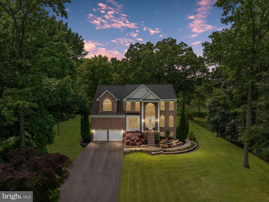 Some homes impress you with features. This one leaves you with a feeling: luxury, elegance, features, form, utility, and most of all—home.

Hidden in its own oasis of a quiet cul-de-sac, this home opens to sweeping, year-round water views—sunrises casting light across its front, golden-hour sunsets melting into the trees behind. It’s the kind of place that gives you permission to slow down and experience bliss, nature, and peace, all with the comfort of quiet community living.

Inside, the home greets you with calm sophistication. Soaring ceilings. Wide-plank oak floors. And a dramatic two-story stone fireplace that turns the main living space into a statement of warmth and welcome. Oversized windows allow natural light to flood in while framing the water like your own piece of living artwork.

This home’s newly updated kitchen is a true showpiece—featuring quartz countertops, stunning stainless appliances, custom cabinetry, and the kind of layout that flows effortlessly into the dining and family areas. Whether you're hosting or unwinding, this space delivers beauty and function in equal measure.

Upstairs, your four spacious bedrooms and two immaculately upgraded bathrooms make everyday life more than easy; you’ll feel as if you’re living at a spa. With all that, it’s the primary suite that truly elevates the experience—expansive and serene, with oversized his-and-hers walk-in closets and a spa-inspired bathroom that screams richness while  making you feel that it’s yearning for you to experience its opulence. 

The fully finished lower level offers flexibility for modern life. With a private walk-out entrance to the backyard, it’s ideal for long-term guests, multigenerational living, or anyone needing stair-free access. This isn’t bonus space—it’s a built-in advantage.

And the lifestyle extends outside. An expansive deck and screened-in porch overlook a huge, flat backyard designed for memories—bonfires, cookouts, soccer games, birthday parties, and moments that last longer than the day.

Beyond the home itself, the area, Churchton, invites connection and ease. You're just minutes from local waterfront restaurants with live music, vibrant marinas, and endless opportunities to enjoy the Chesapeake lifestyle. And for commuters or military families, the location is just as practical as it is peaceful—a short commute to Washington D.C. and nearby military bases.

Each aspect of this space, this home, this lifestyle has been thoughtfully curated—elevated with care, refreshed with intention, and ready for your next chapter.

This isn’t just a home. It’s the one that makes you feel something.

Welcome home.