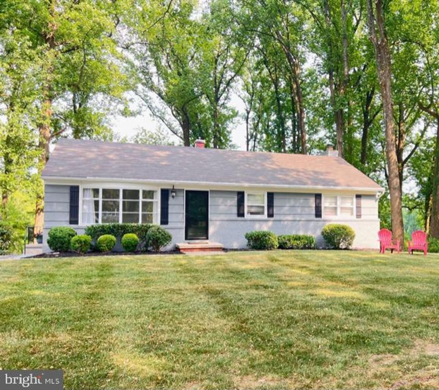 Set amid a wooded homesite is this striking rancher featuring enriched hardwoods, a living room
with custom built-ins and a bright bay window, a dining room with stylized banquette seating,
and an eat-in kitchen. A skylight adds natural light to the kitchen boasting a butcher block
island, Kraftmaid soft-close cabinetry, and stainless steel appliances. Step outside to a sizeable
deck and down to a patio. Bonus living space is found in the lower level highlighted by a rec
room with a brick surround wood burning fireplace, a bathroom, a laundry room, extra storage, and a walkout
to the backyard.