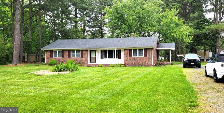 Welcome home to this gorgeous, 3 bedroom, 1 bath brick, ranch style home in the quaint town of Princess Anne.  Entering in from the side entrance you will be pleased to find a stunning family room with wall to wall carpet, decorative ceiling beams and built in cabinetry.  The main room is large and offers an open concept, living room and kitchen combination.  Featuring original hard wood flooring throughout, a large living room space and a gorgeously updated kitchen.  Huge center island, all white cabinetry, granite counter tops and stainless steel appliance.  A dream kitchen for sure!!!  Down the hall you have 3 nice bedrooms, all with loads windows for natural sunlight, hard wood floors and a full bath with a double sink vanity.  Landscaping is paid for by the owner, so you can sit back and enjoy the view.  Don't miss your chance to tour this home today!!