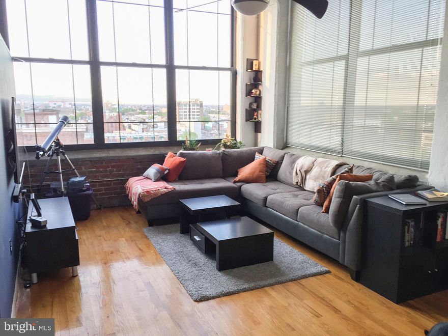 Come make this desirable loft your next home. This corner unit boasts floor-to-ceiling windows with breathtaking views and incredible natural light. The exposed brick leads you into the main living space with 12-foot ceilings, and the kitchen features granite counter tops, microwave, dishwasher and additional storage space under the stairs. The spacious bathroom leads you to another storage area with built-in shelves for extra storage. The unit offers a washer / dryer and ceiling fan. The building has secured access and is conveniently located close to parking and public transportation. It is just a short walk to the center of the city and all that it has to offer.