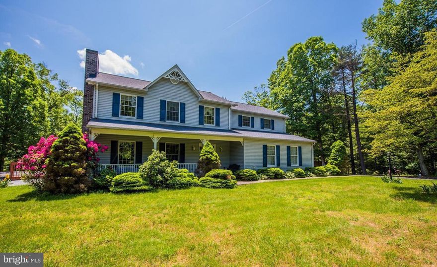 Secluded, peaceful living in the Colonial home boasting spectacular forest and mountain views! 4 beds, 2.5 baths. Over 2,800 sq. ft. LR with brick gas fireplace. Spacious kitchen with breakfast bar and plenty of cabinet/counter space. Main level family room and dining room. Sunroom with deck access. Master bedroom has attached master bath. Open loft area on upper level. Unfinished basement is great for potential workshop area. Large covered deck overlooks backyard.  Located on 10 gorgeous acres with above ground pool. Close to I-70 & PA.