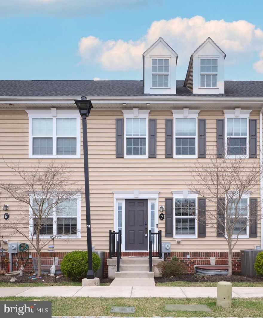 Beautiful courtyard unit in upscale Carriage Hill. Neutrally appointed, the front entry leads you into an open family and living room, accented with a blue stone fireplace that bridges the living and dining rooms and gives way to the gourmet kitchen featuring stainless appliances and abundant cabinetry. A half bath completes the first floor. On the second floor, a primary bedroom suite, bathed in diffused light, offers a full bathroom and walk-in closet. Sharing this level is the second bedroom, containing a generous closet. There is a full bathroom located in the hallway. On the third floor is a flexible room, which could be bedroom #3 or even a study. A partially finished basement offers a bright and sunny entertainment space and a separate laundry room/storage area. The rear of the property provides an outdoor area for grilling (containing a buried gas line) or relaxing and enjoys a large open grassy area behind these courtyard units at 3611. No other block in Carriage Hill offers this feature.
