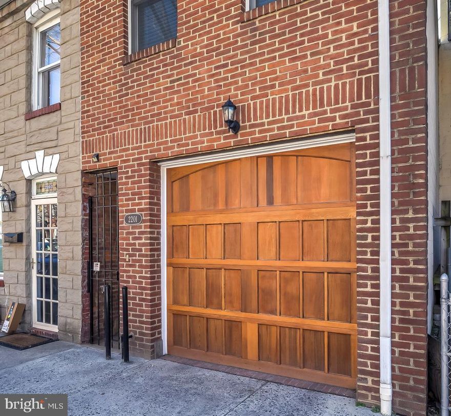 NOW AVAILABLE - BEST LOCATION IN BALTIMORE: Super unique, Canton/Fells home with a GARAGE! Welcome to 2201 Essex St. an affordable house that literally checks all of the boxes: location, garage parking, roof-deck and storage, plus functional and private outdoor patio space. This home is very secure, with a large iron gate at the front, making package delivery a breeze. Moreover, there is a one-car garage that fits seamlessly into the all-brick front of the house. Once inside you'll immediately notice the natural light and floor to ceiling windows that leads out to a gorgeous private patio! The main level is a perfectly appointed all-open floor plan with a beautiful custom kitchen with brand new sink, disposal and dishwasher. Light, beautiful hardwood flooring and ceramic title runs throughout this 2 bedroom 2 bath home. The master suite is complete with a chic barn door over (one) of THREE lighted closets, with a large, bright bedroom. The master bathroom has an all new shower/tub, toilet and faucet.  Behind the second barn-door is the second bathroom which has a marble-like oversized shower that feels like a spa and is TOTALLY brand new. Enjoy a tankless hot water heater for ENDLESS hot water! The owner has custom-built extra hidden closets in the hallway plus the second bedroom which truly maximizes storage and ease of living. The third level features a spacious roof-deck with built-in seating and great sun exposure PLUS shade from a stunning tree for those hotter days.  Additional and equally important details include: new main roof and all new blinds. Call the listing agent directly to schedule your private tour.