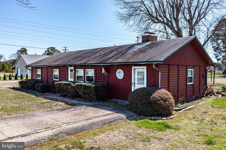 Nestled in a serene rural setting, this ranch-style home is ideal for those seeking a tranquil lifestyle. With 1.46 acres of lush land, this property boasts views of Cockrell's Creek, where the gentle sounds of flowing water create a peaceful ambiance. Step inside to discover a warm, cozy atmosphere. The spacious living area is anchored by a charming gas fireplace, perfect for gathering with loved ones on cool evenings. The home includes three bedrooms, with an entry-level bedroom providing convenience and accessibility. Natural light floods the home through thoughtfully placed windows, allowing you to enjoy the picturesque views of the creek and surrounding landscape from the comfort of your living room. Outside, the property features a private dock site on Cockrell's Creek, offering direct access to a variety of water activities. Whether you enjoy fishing, kayaking, or simply relaxing by the water, this home provides the perfect backdrop for an active lifestyle. For those who appreciate outdoor storage, a detached garage with space for two vehicles and additional storage options is available, along with a barn/shed.