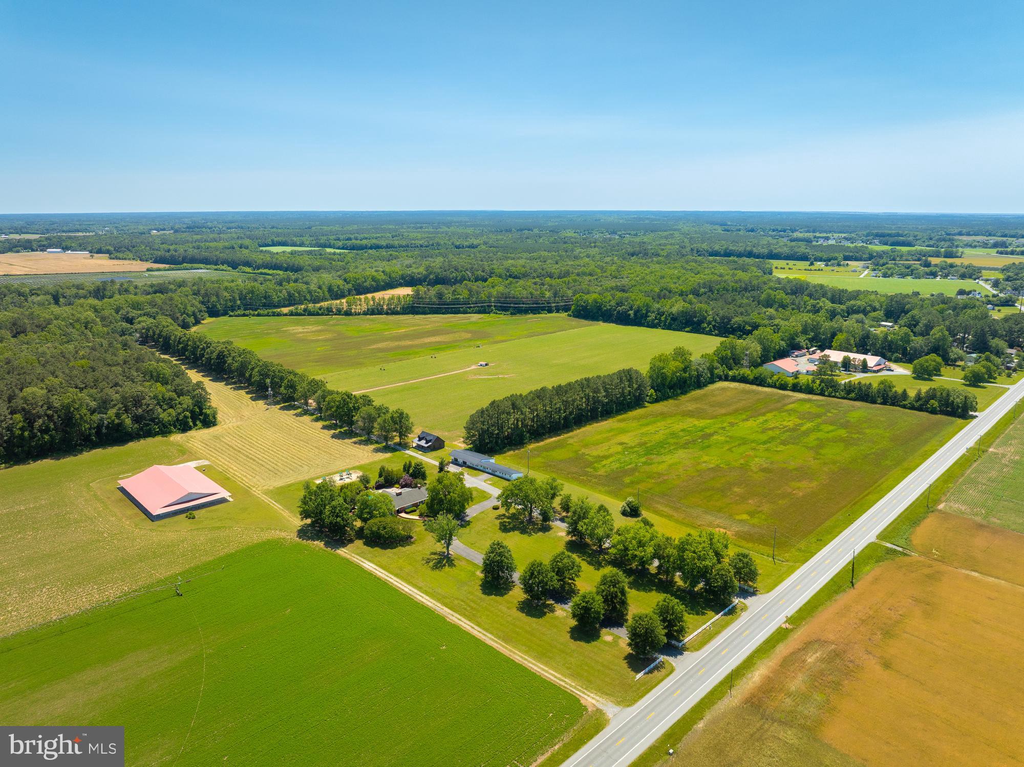 Exceptional 34-Acre Estate Just Minutes from Salisbury
Discover a rare opportunity to own a 34-acre estate in a peaceful, rural setting—just 5 miles from downtown Salisbury. Surrounded by natural beauty and open space, this property offers the ideal balance of lifestyle, productivity, and privacy. An additional 174.17 acres across three contiguous parcels are also available (see listing agent for details). The property features a mix of cultivated farmland and 8 acres of developed open space, well-suited for agriculture, recreation, or expansion. A long-term farming tenant currently leases the cropland at $70/acre annually and is interested in continuing.
Main Residence
This beautifully updated 3,433 sq ft ranch-style home boasts 4 spacious bedrooms and 2.5 baths, with quality upgrades throughout. Highlights include: Custom kitchen remodel, Renovated bathrooms (2019), New roof (2014), and a Dual 5-ton hybrid HVAC systems (gas & electric). Perfect for entertaining, the outdoor space features a hardscaped patio, composite deck, screened rear porch, and an in-ground pool surrounded by mature landscaping.
Accessory Structures
10,000 Sq Ft Multipurpose Building – Fully insulated with a conditioned apartment, ample storage, and a 12’H x 14’W roll-up door. Ideal for equipment, hobby use, or income-producing potential.
1,800 Sq Ft Custom Two-Story Structure – A newly built retreat with upscale finishes, full kitchen, bathroom, gas fireplace, and a hidden bookcase door leading to a cozy upper-level suite—perfect for a guest house, studio, or ultimate man cave.
4,900 Sq Ft Mixed-Use Building – Includes two large garage bays, a 1-bedroom apartment with walk-in closet, oversized laundry room, and additional storage space. This building is fully self-contained with its own well and septic system.
Whether you're seeking a private estate, working farm, multi-generational compound, or income-producing retreat, this extraordinary property delivers unmatched flexibility and infrastructure.
Schedule your private showing today to explore the full potential of this one-of-a-kind offering.