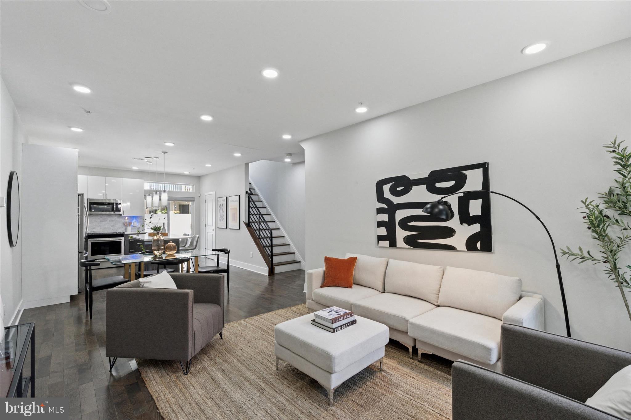 Experience luxury living on one of the best blocks in Graduate Hospital at 1738 Montrose St, Unit A. This spacious, 3-story newer construction townhouse-style condo offers 3 bedrooms, 2.5 baths, and a modern open layout with high-end, timeless finishes throughout. Seller even added custom Hunter Douglas blinds. Equipped with 2 outdoor spaces, enjoy your large private patio off the main level and a balcony off the grand primary suite, which is complete with an office space, a wet bar, a massive walk-in closet, and a spa-like bathroom with a dream soaking tub and walk-in shower. With a park on the corner and a playground on the block, this home blends upscale comfort with ideal city living. All this and tax abatement until 10/31/2030 which reduces your taxes. Philly living at its very best!