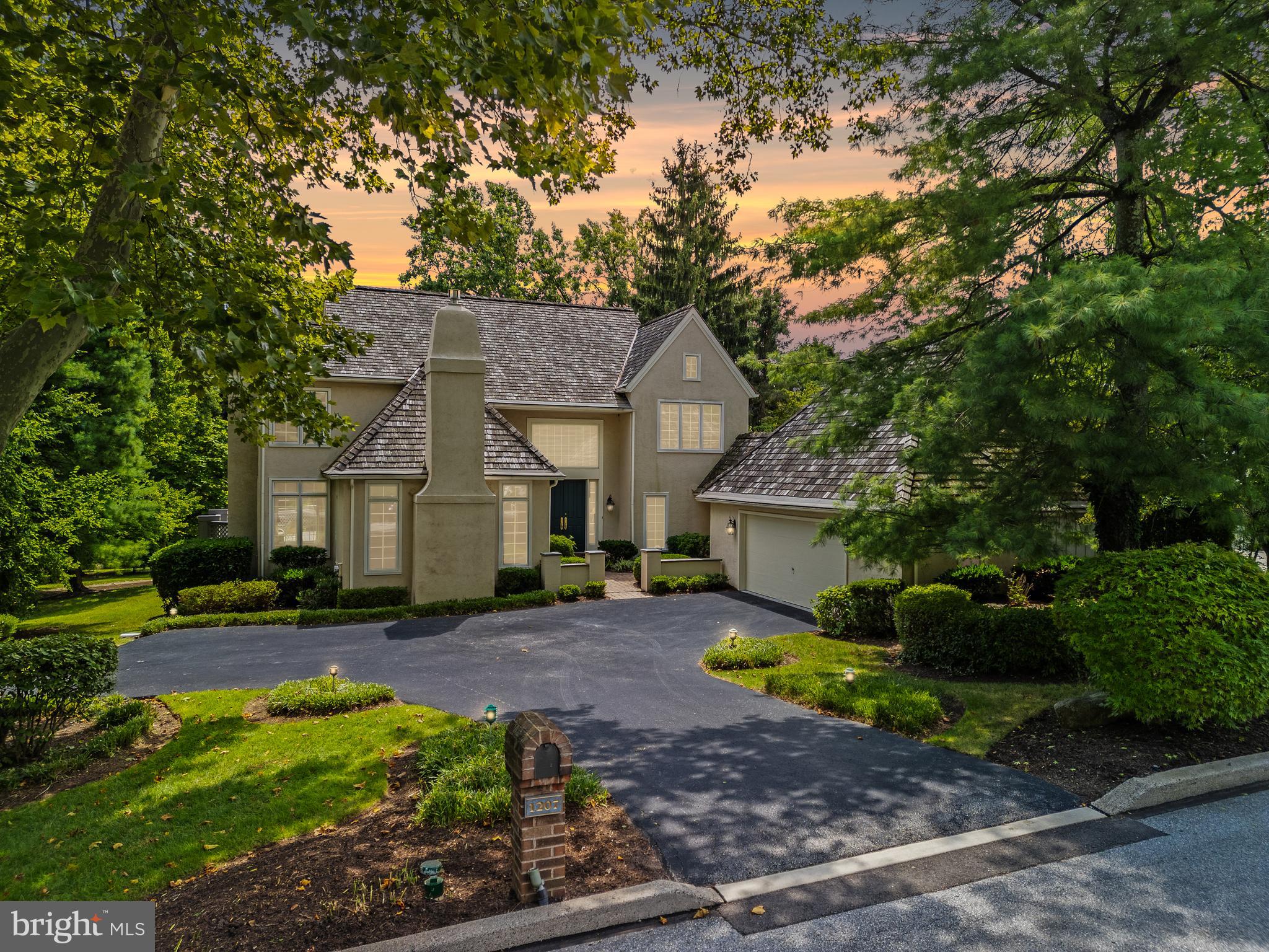 Nestled in the highly desirable Denbigh community, this stunning 4-bedroom, 3.5-bathroom single-family home offers the perfect blend of suburban tranquility and urban convenience, with advantages of both Wayne and Upper Merion. The meticulous landscaping, maintained by the homeowners' association, enhances the home's curb appeal. Walk through double doors into an impressive two-story foyer that sets the tone for the rest of the house. The inviting carpeted living room complete with a cozy fireplace. The open floor plan includes a dining room with floor-to-ceiling windows and French doors that lead to a recently updated, large private deck—ideal for peaceful outdoor relaxation. The heart of the home is the light-filled kitchen with Viking stainless steel appliances, breakfast room, and family room combination, which boasts hardwood floors and yet another wood-burning fireplace and a walk out through the sliding doors to the patio. Spacious office features another fireplace, wall-to-wall windows, and built-in shelving, perfect for displaying books, photos, or collectibles. The finished lower level, with new carpets, fresh paint, and updated lighting, offers a versatile space that includes a play area, family room, additional bedroom, full bathroom, gym, and a fully equipped kitchenette, making it perfect for guests or household help. The walk-out basement is bathed in natural light and opens to the serene backyard. Upstairs, the second-floor hallway gleams with hardwood floors, leading to the primary bedroom with ample storage, an ensuite bathroom featuring dual sinks, a walk-in closet, a soaking tub, and a separate shower. Two additional bedrooms share a full hallway bathroom. Outside, the neighborhood is perfect for strolls under mature trees, with nearby trails, dog-walking paths, and bike routes. The location is unbeatable, with proximity to Main Line entertainment, King of Prussia Mall, major routes, and more.