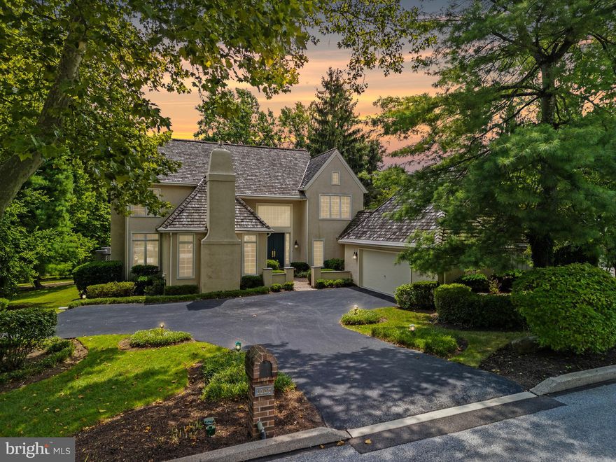 Nestled in the highly desirable Denbigh community, this stunning 4-bedroom, 3.5-bathroom single-family home offers the perfect blend of suburban tranquility and urban convenience, with advantages of both Wayne and Upper Merion. The meticulous landscaping, maintained by the homeowners' association, enhances the home's curb appeal. Walk through double doors into an impressive two-story foyer that sets the tone for the rest of the house. The inviting carpeted living room complete with a cozy fireplace. The open floor plan includes a dining room with floor-to-ceiling windows and French doors that lead to a recently updated, large private deck—ideal for peaceful outdoor relaxation. The heart of the home is the light-filled kitchen with Viking stainless steel appliances, breakfast room, and family room combination, which boasts hardwood floors and yet another wood-burning fireplace and a walk out through the sliding doors to the patio. Spacious office features another fireplace, wall-to-wall windows, and built-in shelving, perfect for displaying books, photos, or collectibles. The finished lower level, with new carpets, fresh paint, and updated lighting, offers a versatile space that includes a play area, family room, additional bedroom, full bathroom, gym, and a fully equipped kitchenette, making it perfect for guests or household help. The walk-out basement is bathed in natural light and opens to the serene backyard. Upstairs, the second-floor hallway gleams with hardwood floors, leading to the primary bedroom with ample storage, an ensuite bathroom featuring dual sinks, a walk-in closet, a soaking tub, and a separate shower. Two additional bedrooms share a full hallway bathroom. Outside, the neighborhood is perfect for strolls under mature trees, with nearby trails, dog-walking paths, and bike routes. The location is unbeatable, with proximity to Main Line entertainment, King of Prussia Mall, major routes, and more.