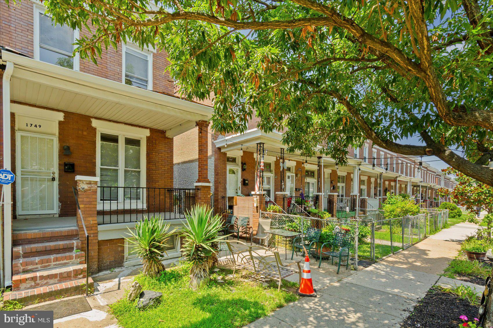 Newly refreshed 3BR/1BA end of row Townhome located on a quaint tree-lined street. Make your way to the covered front porch and open the door into your new home. Inside you will find a freshly painted interior, tons of natural light, and easy care flooring. The main floor offers an open floor plan featuring a spacious living room, sizable dining room, kitchen, and laundry room/pantry. The kitchen offers plenty of cabinets and counter space, stainless steel appliances, and a deep stainless sink. Tucked behind the kitchen is the laundry room with tons of space for storing pantry items. On the second floor are two sizable secondary bedrooms, a spacious primary bedroom, and a full bath with a walk-in shower. The lower level is unfinished, clean and dry offering the opportunity to create additional living space for your family's needs. From the kitchen step outside to a fenced yard with a large patio area ideal when entertaining family and friends. This home is move-in ready with so much to offer new homeowners, and is located in close proximity to shopping, restaurants, and commuter routes.