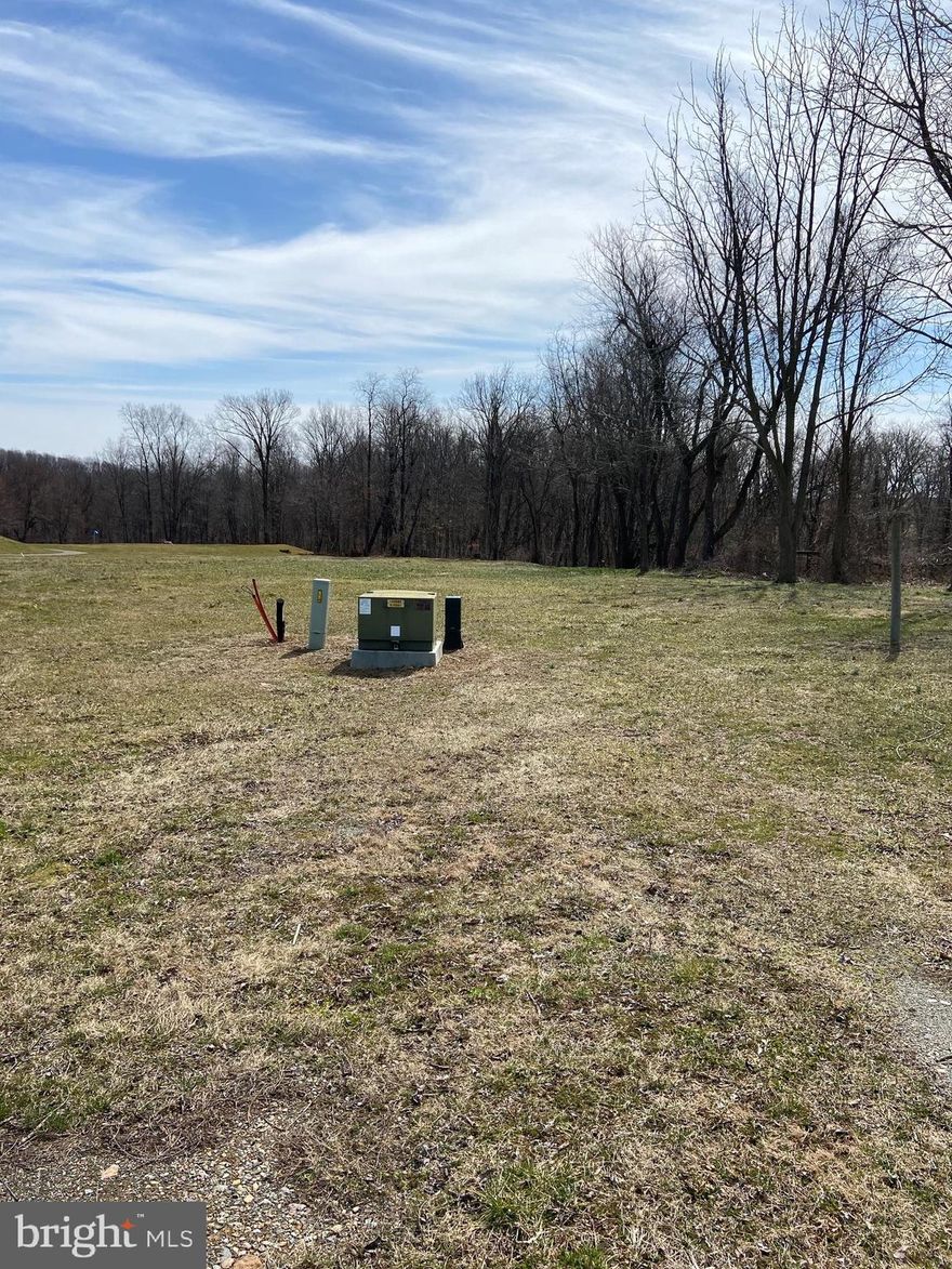Premium lot adjoining Tanglewood Golf Course to the rear, and views of preserved farmland in the front. Private street access with shared maintenance agreement. Exclusive local builder is award winning Custom Home Group.
