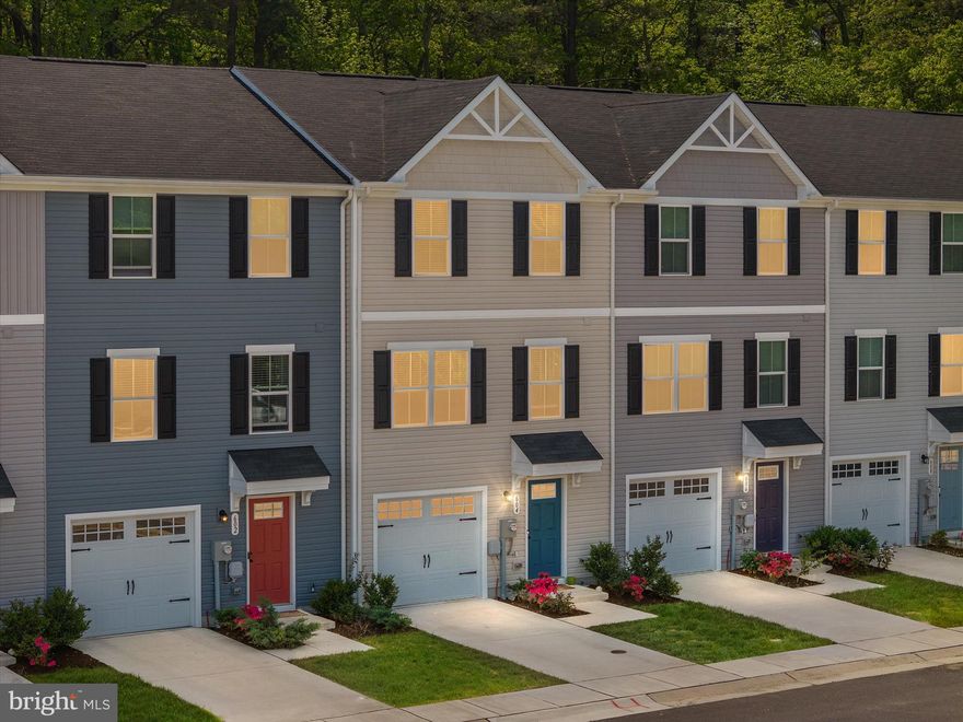 Well-Appointed & Move-In Ready, this Spacious 2 years young 3-level Garage Townhome in the Heron Point community is looking for its next owner! Located towards the of a dead end street & backing to woods provides Peace & Serenity allowing you to take in the sounds of nature as you enjoy your morning coffee or dinners on your back 10x14 Trex Deck conveniently located off the main level.  1st level features an extended 1 car garage, foyer + finished space perfect for a gym, home office, or 4th bedroom w/ Large storage closet & utility room + a walk out door to the BRAND NEW paver patio! Sleek & Low Maintenance Upgraded Luxury Plank Vinyl floors run throughout the 1st & 2nd levels. The Expansive Main Level is an Open Floor Plan with the Family Room expanding into the Gourmet Kitchen w/ Espresso Cabinets, Stainless Steel Appliances & Dining Room that all lead to the Back Deck.  Upstairs you’ll find the Primary Suite w/ walk in closet + en suite Full Bath, full size laundry, and 2 sizable bedrooms.  Additional upgrades included recessed lighting & ceiling fans in all 3 bedrooms & Family Room, WiFi enabled thermostat & garage door opener, custom blinds throughout & a powder room on the main level!  Conveniently located JUST minutes from Rt50 for all of your shopping needs + restaurants like RAR Brewing, Ava’s Pizzeria & the Dive Club are less than 5 minutes away. The Choptank River, Bill Burtons Fishing Pier, Sailwinds Park & Playground, River Marsh Golf Course, the Choptank Light House & MUCH MORE are all at your fingertips! All of this at an UNBEATABLE Price, waiting for YOU to call it HOME! Be Sure to Check out the 3D Floor Plan!