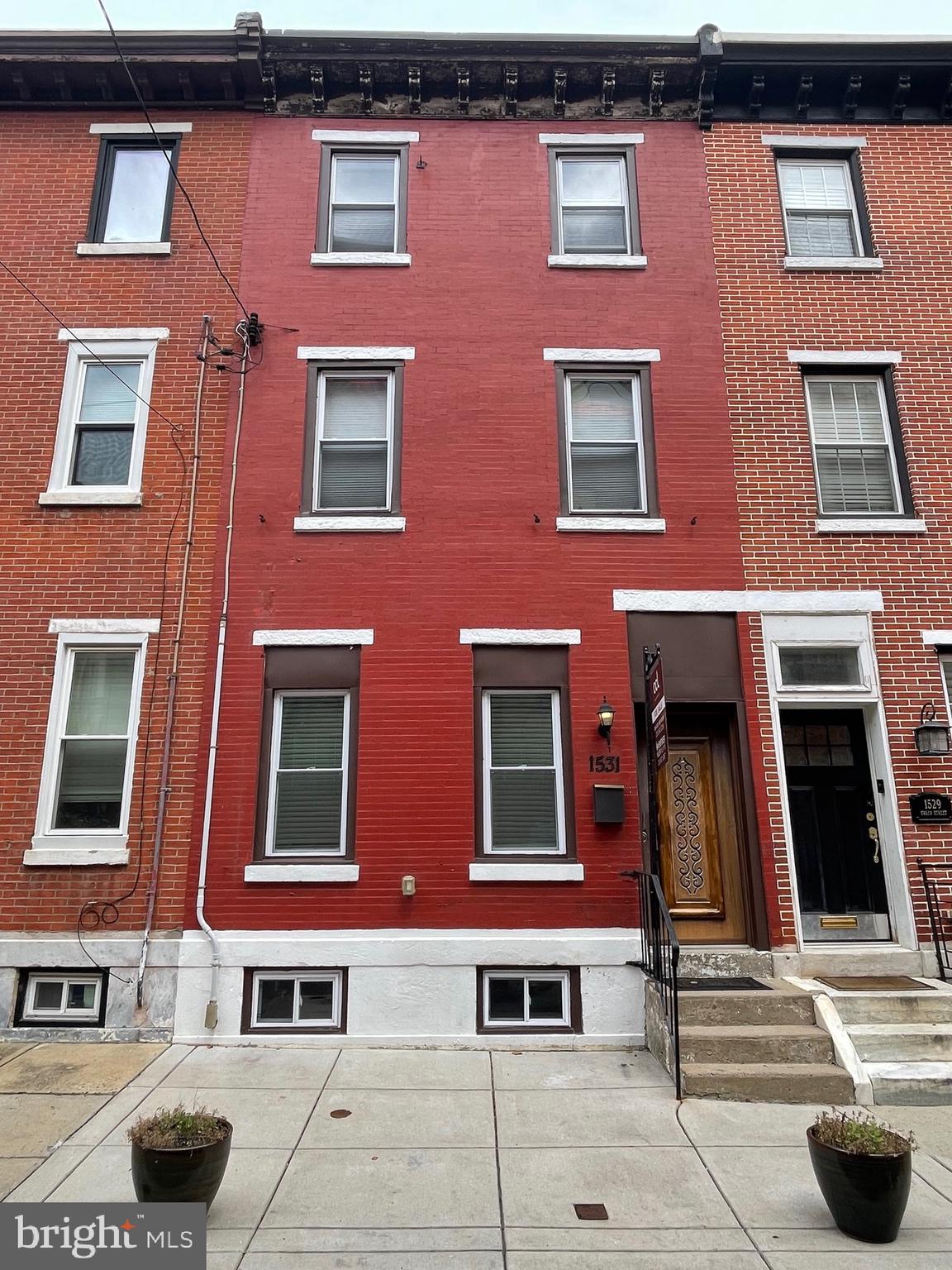 Welcome to 1531 Swain Street, a beautifully updated 3 story home located on a quiet, low-traffic block in the desirable Fairmount neighborhood. Renovated in 2019 this spacious and light-filled property blends classic charm with modern comforts across three well-appointed levels.
Step inside to find a bright living room featuring hardwood floors and two large windows that fill the space with natural light. The main level also includes a dedicated dining area and a thoughtfully designed kitchen. The kitchen is a chef’s dream, offering a large center island, ample cabinet and counter space, stainless steel appliances including a French-door refrigerator, and a window over the sink for added light. A conveniently located half bath and access to your private, fenced-in backyard complete the first floor.
The second level features two large bedrooms with hardwood floors and a spacious full bathroom. On the third floor, you'll find the expansive primary bedroom, a stylish bathroom with dark tile and a glass-enclosed shower, and an additional bedroom—ideal for a guest room or home office.
The home also includes full unfinished basement with laundry, storage space, and mechanicals.
With its ideal location in one of Philadelphia’s most beloved neighborhoods, thoughtful layout, and modern updates, 1531 Swain Street is a perfect property as your home or investment. Don’t miss this opportunity to own a piece of Fairmount!