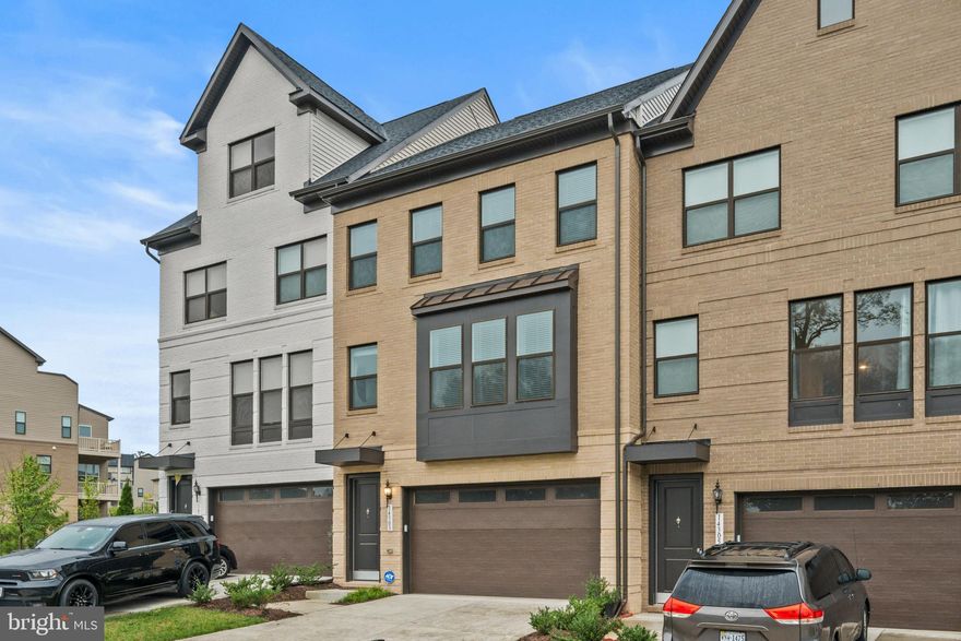 Modern, luxury townhome living at its finest. Come explore this two year young, four level Bennington model with fourth floor loft and rooftop deck.  ***  The lower level features the two car garage with EV charger, large rec room with sliding glass door leading out to your backyard and oversized half bathroom with room to potentially expand into a full bathroom.  ***  The open concept main level features a mid-kitchen layout with a huge center island along with the dining room with box window, living room, powder room and deck off the rear of the home.  ***  The third level features the Primary Suite with en-suite bathroom, plus two additional bedrooms, second full bathroom and laundry room.  ***  The fourth level features the loft with wet bar and rooftop deck areas.  ***  There's room for two vehicles in the garage plus space for two additional vehicles in the driveway. There is also plenty of additional parking in front of the townhome and throughout the community.  ***  Peacefully nestled in The Boulevards at Westfields, which is only a short walk to Eleanor C. Lawrence Park and a quick drive to shopping, dining, retail, major routes/local arteries, and Washington Dulles International Airport.