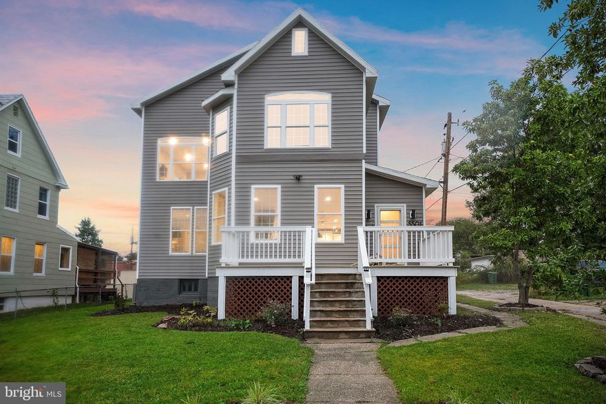 OPEN HOUSE IS CANCELED - CONTRACT PENDING. This fully renovated home boasts modern convenience and style, designed with comfort in mind. Purchased, almost completely rebuilt, added on to, and designed as a forever home, they thought of everything. Tons of natural light pours in through the oversized windows and panoramic glass door off the dining area. The main level features an open floor plan with clearly defined living spaces including a legal bedroom. The open-concept kitchen is a chef’s dream, featuring gas cooking, a large observation island, a pot filler, granite counters, stainless steel appliances, mud alley and message center. The dining area is just the right size for small and large gatherings complete with wet bar and beverage fridge. The gas fireplace, window seats and bay window make the living area perfect for entertaining or a quiet night in. Only the pictures can convey the luxury of the primary ensuite with modern clawfoot tub, rain shower w-custom tile and steam sauna jets, chandelier, heated floors, double vanity, and walk-in closet. Two other spacious bedrooms, another full bath and laundry complete the 2nd level. The 3rd floor offers loads of space, an oversized closet and a complete rough in to add a full bath in the future.  This tech savvy gem is equipped with keyless entry, a central AV closet, Ethernet and cable wiring throughout the home for your networking needs, smart home thermostats, and Ring security system for peace of mind. The outdoor spaces allow for comfort in the front or rear of the home. The back deck features a lower level designed for a hot tub and the yard may still be bearing fruits and veggies from the lil' gardeners who used to live there. 5501 Fair Oaks has all the modern amenities you need, blending luxury with everyday efficiency and functionality. Minutes from Morgan State, downtown, shopping, dining, commuter routes and more.