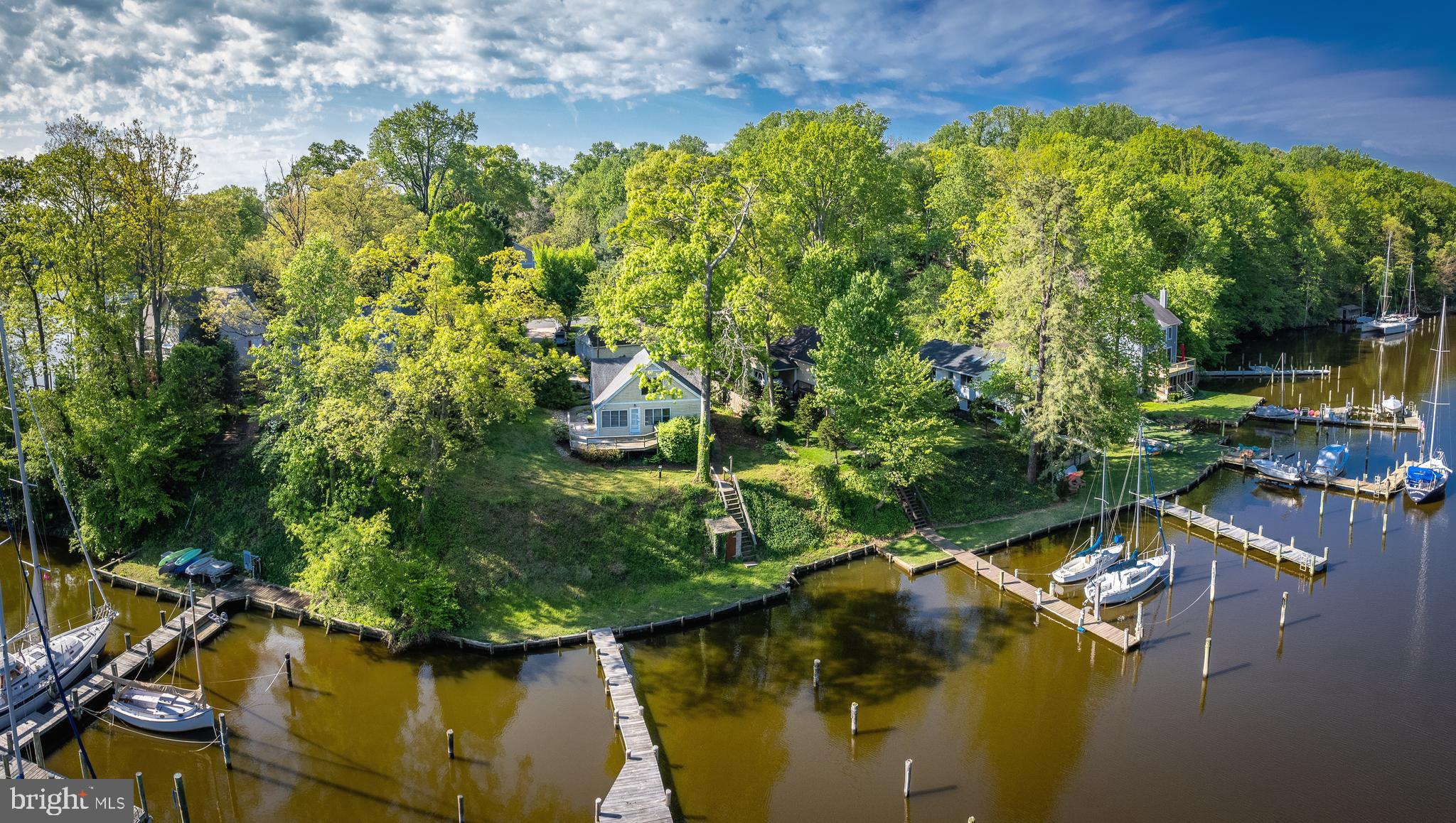 NO inspections were conducted by buyer- Home sold as is-HUGE PRICE REDUCTION! t**Cozy 2 BRM bungalow in good condition -can be expanded* Fabulous Setting* DEEP (8ft) water 60 ft. pier w/ 4 slips* but can accommodate 6 boats* approx 98 ft on scenic Martins Cove opening to MIll Creek/minutes to USNA and Annapolis-Rare traffic on this road boasting a private quiet hideaway * Ideal 2nd home! NO bridges to Bay..a boaters dream! Gentle slope to pier w/ NO threat of flooding*Top Architect designed landscaping w/ Paver Driveway* Oversized 2 car garage- An ADU (additional dwelling unit) is a possibility* Plenty of Parking*
Consider as Rental property with income (dock space, rent the house, and use the pier*
*3 yr old 16 seer Heat Pump* New architectural shingle roof /gutter system - 2010*
"A Handyman Special" this home is totally livable but buyers may want to update/renovate to reflect 2023 living and lifestyle.. Nearby USNA Facilities/Greenbury Point Nature Center/USNA Golf Course & downtown Annapolis* NO HOA! Bulkhead and House sold "as-is" **Seller reserves the right to do a 1031 Exchange- SEE DISCLOSURES