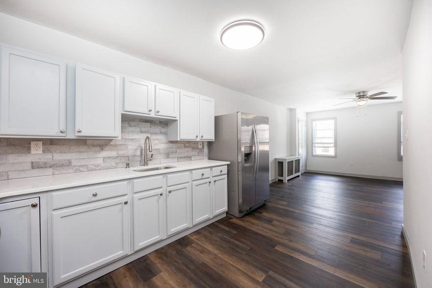 Welcome to 58 E 4th St!  This fully remodeled, 2-story apartment could be your next home.   On the main floor, you will find the living room, kitchen, bathroom,  as well as a bonus room that has the washer and dryer, which has enough space to use as an office, as well. The upper level showcases the 2 spacious bedrooms.  Updates throughout  include new vinyl flooring, and carpets.  The kitchen has new quartz countertops, tile backsplash, and stainless appliances.  Also included is an LG stackable washer and dryer.  Water, Sewer, and Trash are included in your rent.  Call to schedule your showing today.