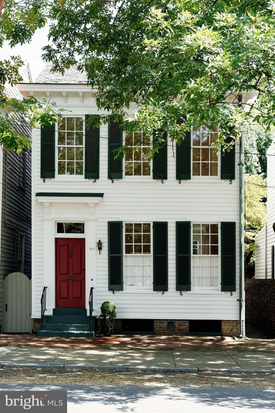 This classic detached townhouse under a canopy of trees in a premier location offers handsome original floors, 10' high ceilings, a proper front hall, 3 bedrooms, 2.5 baths.  A gracious dining room with fireplace is nearby the renovated chef's kitchen with Bosch appliances, quartz counters and adjoining family room. Garden oasis is bordered by antique serpentine brick wall. Fireplaces are as is.