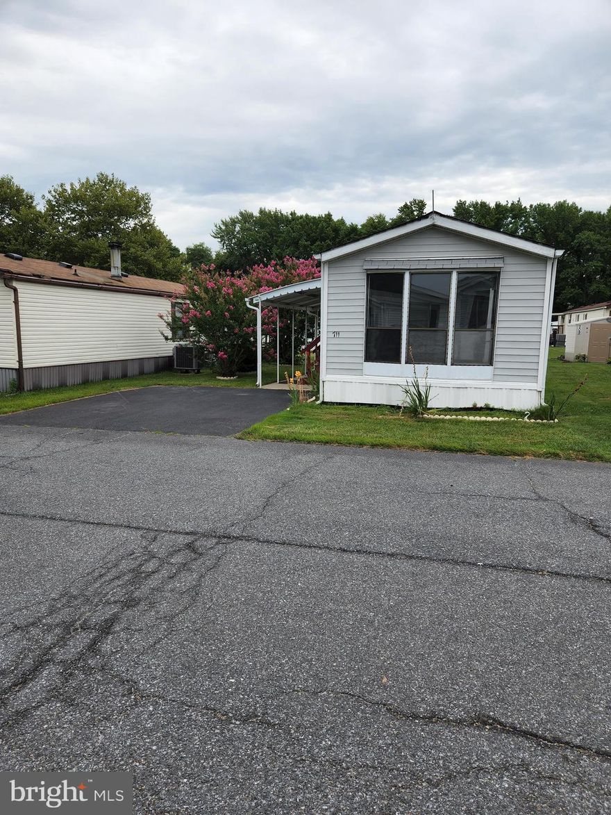 Home recently remodeled granite countertop stainless steel appliances. Laminate flooring new carpet and pad