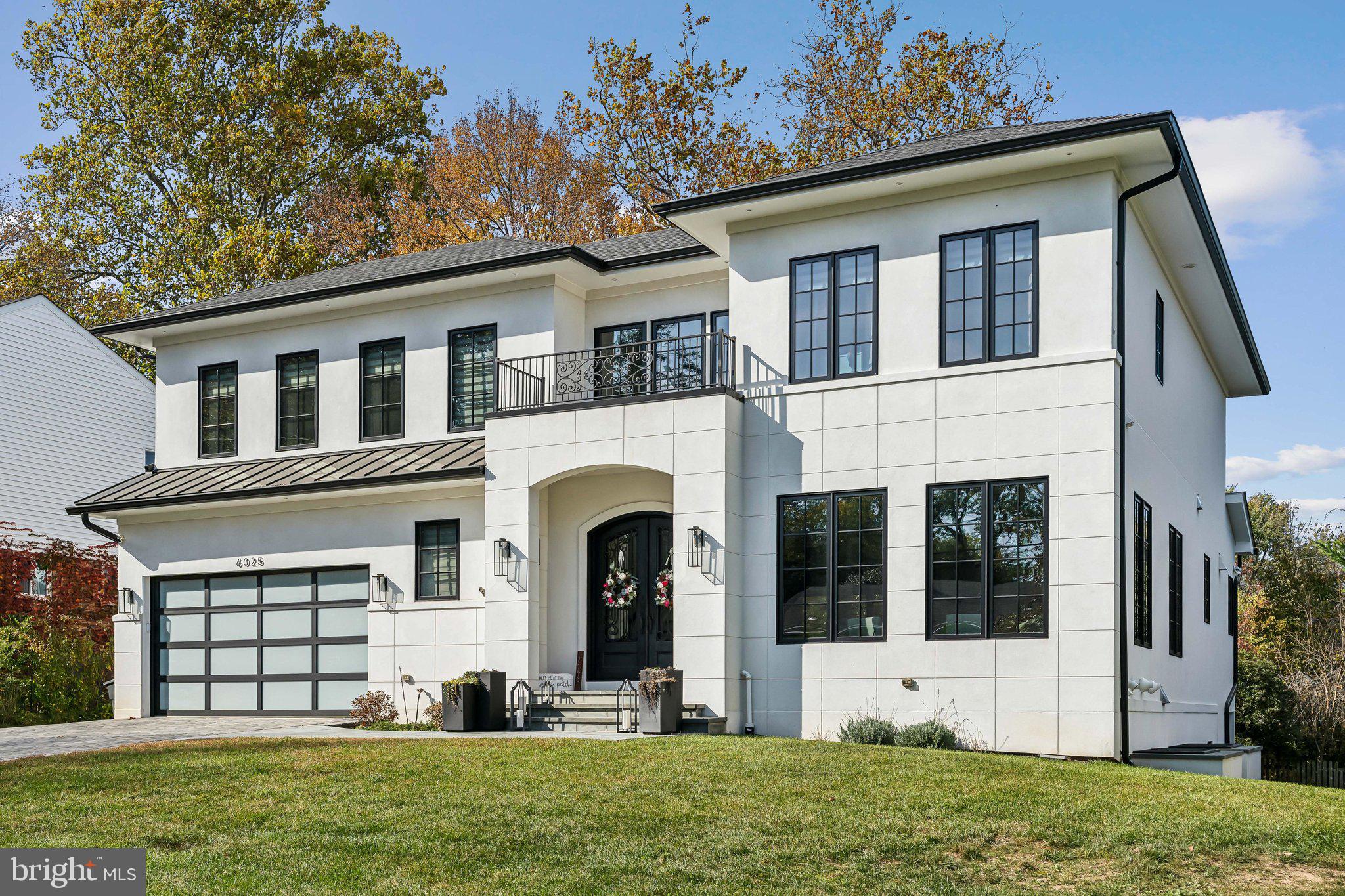 Luxury Meets Innovation: A Home Like No Other in Wildwood Manor. Welcome to an unparalleled luxury home, a masterfully crafted new construction built by Delevano Design Build offering 6,000 square feet of sophisticated living space with an elevator. This 7 bedroom, 6.5 bath residence embodies elegance at every turn, boasting custom finishes, cutting-edge technology, and an attention to detail that sets it apart. As you step inside, a sun-drenched open floor plan welcomes you with soaring ceilings, exquisite millwork, and wide-plank hardwood flooring. The grand foyer leads into a main level designed for both intimate gatherings and large-scale entertaining. At the heart of the home, the chef’s kitchen is a vision of culinary excellence, where a striking marble island and countertops set the tone. Every detail has been meticulously curated, from the custom cabinetry to the professional-grade Subzero and Wolf appliances. A butler’s pantry and walk-in pantry provide additional prep space, a wine fridge, and custom storage. Adjacent to the kitchen, the family room offers a seamless blend of style and comfort. A sleek gas fireplace, set against a custom stone accent wall, creates an inviting focal point. Floor-to-ceiling glass doors lead to a spacious Trex deck, perfect for entertaining. Beyond the kitchen and family room, the living and dining areas exude warmth and sophistication, enhanced by custom lighting, coffered ceilings, and walls of windows that frame the beautifully manicured grounds. A statement powder room near the living spaces adds a touch of luxury, featuring a brass wall-controlled faucet that gracefully pours into a mother-of-pearl sink, creating a moment of artistry in everyday living. Upstairs, the second floor is a sanctuary of comfort, with 4 ensuite bedrooms, each designed with finely finished bathrooms, custom walk-in closets, and abundant natural light. The primary suite is a showpiece of luxury, boasting a marble-clad bathroom with dual vanities, and a large dressing room with bespoke built-ins provides both function and indulgence. Descending to the lower level, the home continues to impress with a fully finished space offering endless possibilities. Two additional bedrooms and a full bath provide private accommodations, while a versatile office or gym caters to both work and wellness. The expansive recreation area, with potential for a bar, opens to a covered veranda and lush greenspace, creating an effortless indoor-outdoor flow. Enhancing both accessibility and convenience, an Inclinator passenger elevator provides seamless access to all three levels, ensuring ease of movement for every stage of life. Whether transporting luggage or simply enjoying the effortless flow between floors, this feature adds unmatched comfort and sophistication. State-of-the-art home automation enhances every aspect of this residence, ensuring that luxury meets modern convenience. A 3 zone Carrier Infinity Series HVAC system provides personalized climate control, while a comprehensive security system with video surveillance delivers peace of mind. A Generac whole-house generator ensures uninterrupted comfort in any circumstance. Even the garage has been designed with innovation in mind. A subterranean car lift allows for discreet, secure storage, offering the ability to park 2 cars on the entry level while lowering a third vehicle below grade. This rare and remarkable feature is perfect for car enthusiasts or those who appreciate smart, sophisticated storage solutions. Wildwood Manor is a vibrant, close-knit community with annual events and more. Enjoy summers at the newly renovated Wildwood Manor Pool, a hub for social gatherings, swim team events, and relaxing summer days. The location couldn’t be more convenient, just steps away from Wildwood Shopping Center, and easy access to I-495, I-270, Grosvenor Metro Station, and more. Schedule your private tour today and experience this masterpiece for yourself.