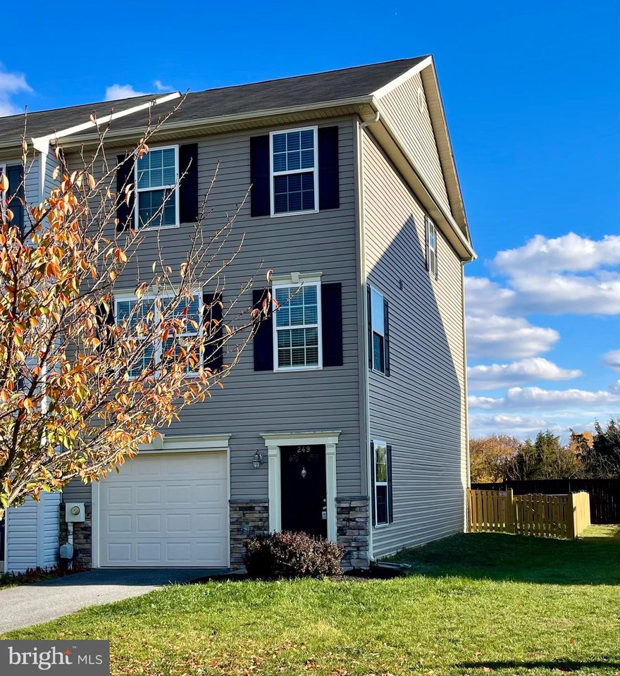 This beautiful 3 level townhome with a garage is not only spacious with a fenced back yard, but it's also an end unit!  Don't miss out seeing this spacious bright home with 1st floor garage, office or family room and a half bath and walks out into the fenced yard.  The second level is open and spacious with a large kitchen, breakfast nook, space for a dining table and a large great room.  The third level has a master bedroom with tray ceiling, master bath with jetted soaking tub, large walk-in closet and laundry on the same level.  As a bonus, all rooms (except bathrooms) have been freshly painted so it is truly move-in ready!  This beautiful and spacious townhome backs to a wooded area with no other homes behind it, you will love sitting on the back deck enjoying the outdoor space.  Schedule your showing today!