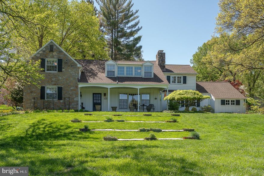 Welcome to 1137 Pugh Road in the popular Wayne neighborhood of
Colonial Village. This expanded Cape Cod Colonial has it all, over
3600 sq ft of versatile space, an updated kitchen and bathrooms, a new roof, a nearly
1.5 acre landscaped lot, with a private patio designed for
entertaining.
A covered front patio leads to the front door portico. Enter into the
formal living room with original hardwood floors, and a wood burning
fireplace surrounded with custom built-ins. Flow straight thru to the
formal dining room, with large sliding glass doors out to the large
brick paver patio, then into the beautiful, newly updated 2024-25 granite,
white-on-white kitchen, with large island, undermount sink, new appliances including a
sub zero refrigerator,  double wall ovens, a dishwasher, barstool seating, with a separate
breakfast area. A laundry room, powder room and two car attached garage entrance provides excellent utility for busy families, and are all accessible thru the kitchen. The kitchen opens to a large, sunny and bright
family room, with vaulted ceiling, center gas fireplace, windows with louvered
shutters, and doors out to both the rear patio and to the
driveway. 
Completing the first floor are two large private bedrooms,
that share a tastefully updated full bathroom, off an alcove hall to the left
of the front door and staircase.  Both bedrooms have hardwood floors, natural light
from two exposures and full closets. This space is currently in use as a home
office, but could also be an in-law suite.
Upstairs you will find the impressive, custom owner's bedroom suite. A very large,
bright bedroom with built-ins under the windows, and hardwood floors.
The suite includes a custom designed closet and dressing room with built in
dressers, closet systems, an ironing station, a  second private laundry closet, and an entrance to the
fully updated owner's bathroom, with every luxury imaginable,
including an oval, soaking tub, separate, twin vanities, a separate
glass stall shower and private WC.  Across the hall are another two
family bedrooms that share a full, beautifully updated hall bath.
This home sits up on a beautiful, landscaped and manicured nearly 1.5
acre private corner lot. The exquisite grounds offer a true natural
sanctuary with several garden beds designed to bloom through the
Spring and Summer seasons. Carefully planted specimen trees provide privacy and the
vibrancy of Autumn colors.  A retaining wall with custom lighting
highlights the heritage plantings and completes the hardscaped patio
area, which includes a gas fire pit.
This house has a complete new roof, a recessed lighting plan throughout, low taxes and easy access to all that
Wayne has to offer, the KOP mall and Town Center, Gateway Shopping Center, Wegman's
and Valley Forge for all outdoor pursuits!