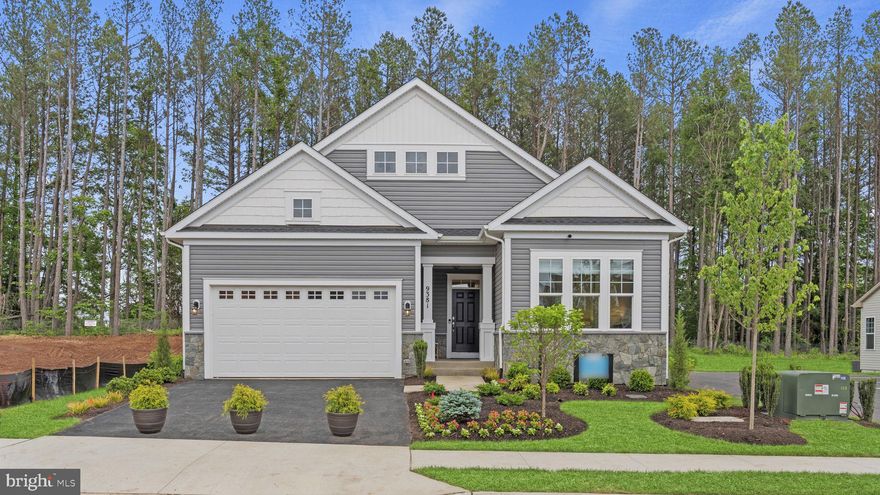 Builder model, is meticulously designed for an effortless lifestyle and is now ready for you to make it yours at The Crest at Linton Hall, an active adult community for those 55 or better!
Step inside to a beautifully appointed interior featuring an Artisan Interior Trim Package throughout, and custom paint colors. The gourmet kitchen is a chef's dream, boasting Kitchen Island Cabinets with an elegant Ellis Laminate - Admiral Finish, complemented by stunning Carrara Morro Quartz Countertops on both the island and perimeter. It's equipped with a Gourmet Appliance Package in Stainless Steel, including a hood, under-cabinet lighting, and custom pendant lighting. Practical additions like rollout trays in the kitchen cabinets and a trash bin cabinet enhance functionality.
The kitchen is open to the family, dining room, and convenient laundry room, making entertaining and everyday easy. Step outside to enjoy the Rear Screened Porch and a Concrete Patio, perfect for outdoor relaxation. The main level also offers serene living with a spacious primary suite and en suite featuring upgraded cabinets in Glacier Gray and Iced White Quartz Countertops, alongside upgraded bath fixtures with a Lahara Champagne Bronze finish.
Descend to the lower level via an elegant Oak Staircase with an Artisan Interior Railing Package. This extended space features 9 ft Foundation Walls, a finished Recreation Room with an Extension, and an Electric Fireplace with a Westcott Mantle and Absolute Black Surround. You'll also find a versatile Lower Level Den and a Lower Level Full Bathroom.
This stunning model home will be available for a December 2025 move-in, don’t wait to make this model, your home!
Located within The Crest at Linton Hall, a new Brookfield Residential community for adults that are 55 or better! Community includes 2 pickleball courts, bocce, horseshoe pit, community garden, covered outdoor kitchen with seating area plus a paved trail to Broad Run Regional trail system! 
Closing cost assistance is available!