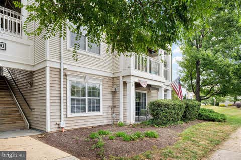 Photo of 11000 Kinship Court #104, MANASSAS, VA 20109 (MLS # VAPW2127122)