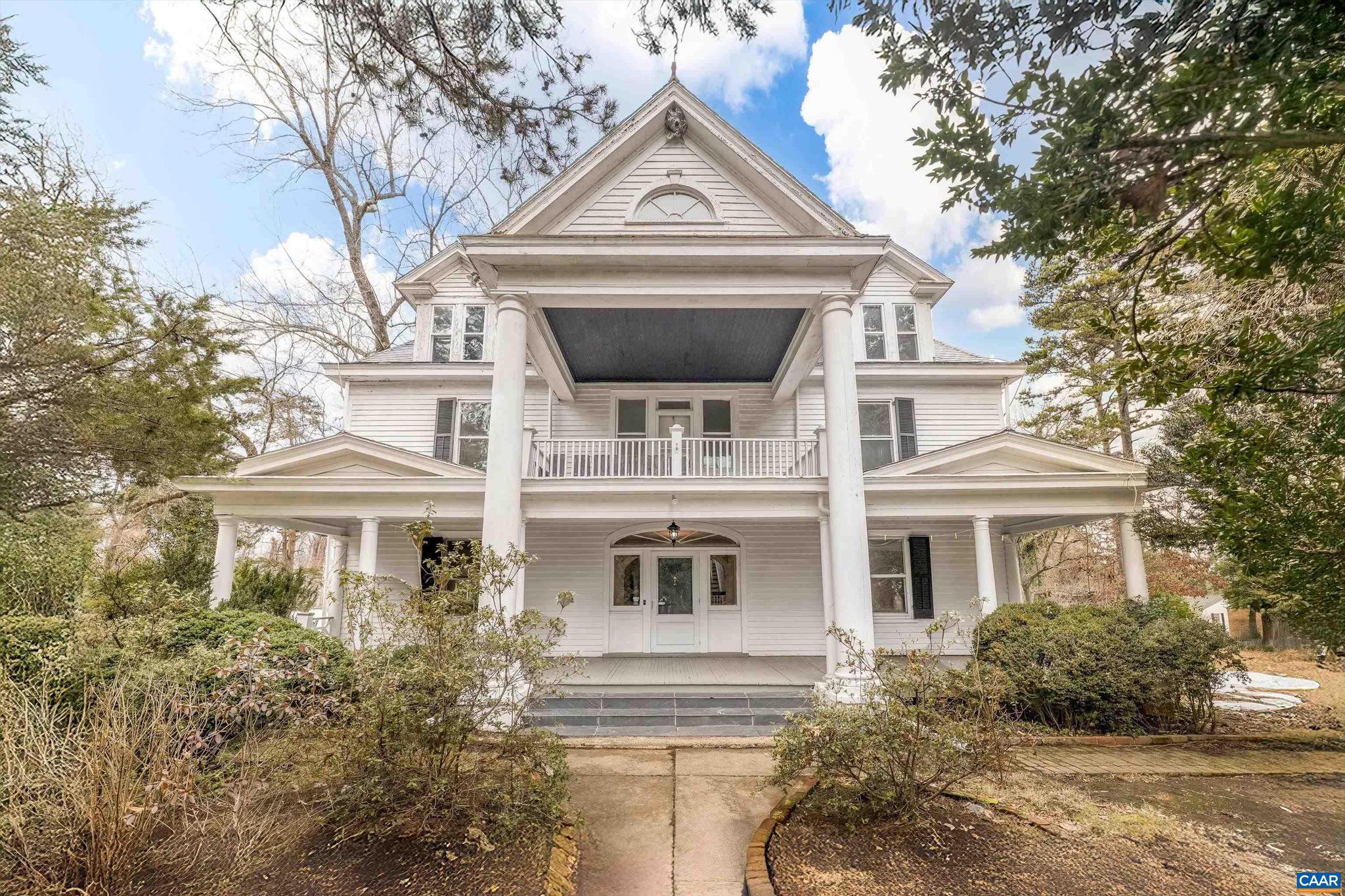 Historic home with privacy, convenience, and lots of charm! Walkable to Downtown Scottsville on 5+ acres, just 5 minutes from the James River. There is 2000+ unfinished sq ft for more living space. Perfect opportunity for a short term rental or bed and breakfast. Just minutes from the James River, this 1914 Greek Revival-style home sits on over five acres, offering endless potential. Classic architectural details include a grand double-columned portico, high ceilings, wood flooring, and multiple fireplaces. The spacious kitchen is a blank slate, ready for customization, while original outbuildings?including a garden house with a working pump?add to the home?s historic charm. With 5 bedrooms and 3.5 bathrooms, this property is perfect for those looking to restore a timeless estate or create a unique bed & breakfast. Located in a serene setting, this property combines the charm of early 20th-century architecture with the tranquility of rural living, all while being conveniently close to local amenities in Albemarle County and Charlottesville. Expand into the large unfinished attic and basement for additional living space.,Formica Counter,Wood Cabinets,Fireplace in Dining Room,Fireplace in Living Room