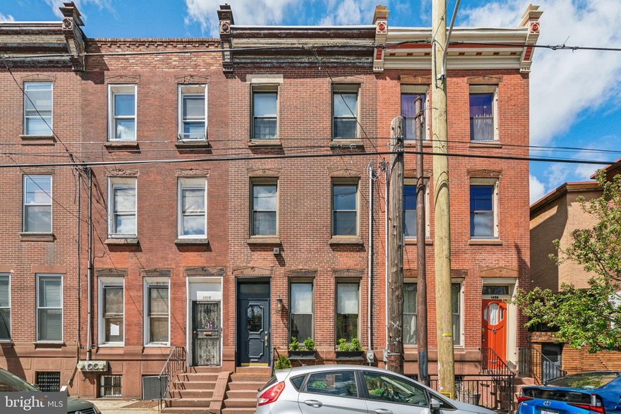 Welcome to this immaculate and thoughtfully updated 4-bedroom, 2.5-bath home in the heart of Passyunk Square. With a perfect balance of original charm and modern updates, this move-in ready home is filled with natural light from three exposures and offers both space and flexibility across four finished levels.

Step into the tiled foyer and you’re greeted by a bright and spacious first floor with soaring 10-foot ceilings, refinished original parquet wood floors, and a decorative fireplace surround. The layout is ideal for both entertaining and everyday living, with a natural flow from the sitting area to the formal dining room, breakfast room, and kitchen. Just off the kitchen, a private back patio offers space for grilling, relaxing, and additional storage.

The second floor includes two generously sized bedrooms with hardwood floors, a hallway full bath, and a convenient laundry zone tucked into the rear bedroom. The front bedroom includes a bonus ensuite room, perfect for a home office, gym, playroom, or walk-in closet—this space also has plans available to convert it into a full bathroom if desired.

Upstairs, the third floor features two additional bedrooms, a half bath, and walk-out access to the roof—ideal for a future roof deck with city views. The brightly lit finished basement adds even more flexible space, with tile floors, a full bathroom with a shower, and plenty of room for a media room, home gym, workshop, or storage. 

This home has been carefully upgraded with a new roof, full electrical rewiring, new HVAC with heat pump, fresh paint, custom baseboards and crown molding, and ample closet space throughout.

Located on a vibrant block with easy parking in the PPA lot directly across the street, this home is just steps from all the best of Passyunk Square—award-winning restaurants, neighborhood cafés, boutiques, parks, and convenient transit options.