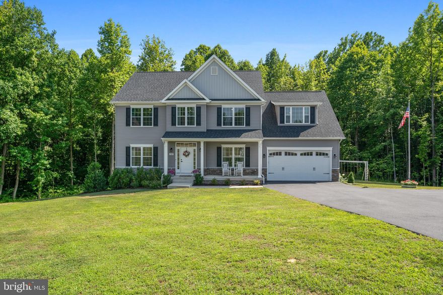 Welcome to home 6360 Hollow Way in Huntingtown, MD! Built in 2022, 5 Bed 2.5 Bath home which backs to wood area and located at the end of a cul-de-sac. The main level is features an open concept filled with natural light, 9’ ceilings, recessed lighting and neutral paint. The generous living room offers a  fireplace with chic floor to ceiling mantel.  The stunning kitchen is wows with quartz countertops, white tile backsplash, center island with breakfast bar, stainless steel appliances, range hood,  farm sink, modern light fixtures and connecting dining room. The family room offers beautiful views of your private rear yard back by trees. The ample rear deck is ideal for grilling out or enjoying your favorite drink. Completing the main level is the office/ additional bedroom. The upper level offers 4 generously sized  bedrooms, large laundry room with built-ins, and  spacious hall full bath with subway tile, ceramic flooring, and vanity with double sinks. The impressive Primary suite features a luxury ensuite spa-like bath with double sinks, glass enclosed shower, soaking tub oversized and massive walk-in closet. Unfinished lower level is waiting to be customized! Enjoy the pretty of nature in your private rear yard. Plant your dream garden, host gatherings, or unwind on the deck. Conveniently located to shopping, dining, outdoor recreation, commuter routes  to D.C., Annapolis, PAX River and Joint Andrews Air Force Base.  No HOA.  Book your appointment today!