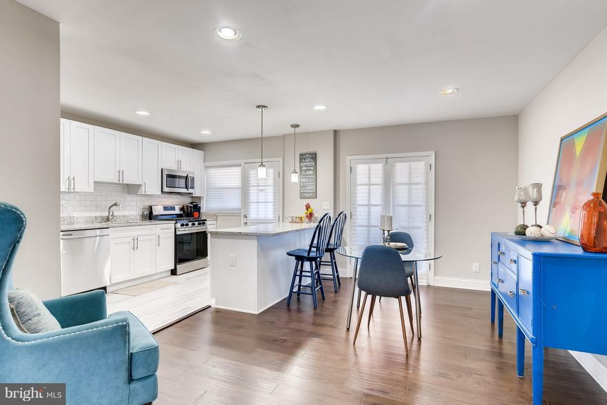 This is the on that you have been waiting for. Welcome to "Wildwood"...This stunning renovation has been designed with you in mind. Enter into an amazing floorpan with a rare half bath on the 1st floor. A cozy living area for warm conversation and a stunning contemporary kitchen for the chef of the house. Walk out into an enclosed porch with an attached deck that overlooks the backyard made for summer fun. Top that off with a built in garage and fully finished lower level that has a full bath and room for entertaining. The upper level bath has a stand up shower with a separate bathtub and dual shower heads, so no one is ever late waiting for the bathroom...What more do you need? Schedule a showing today and "Meet me at the table"...