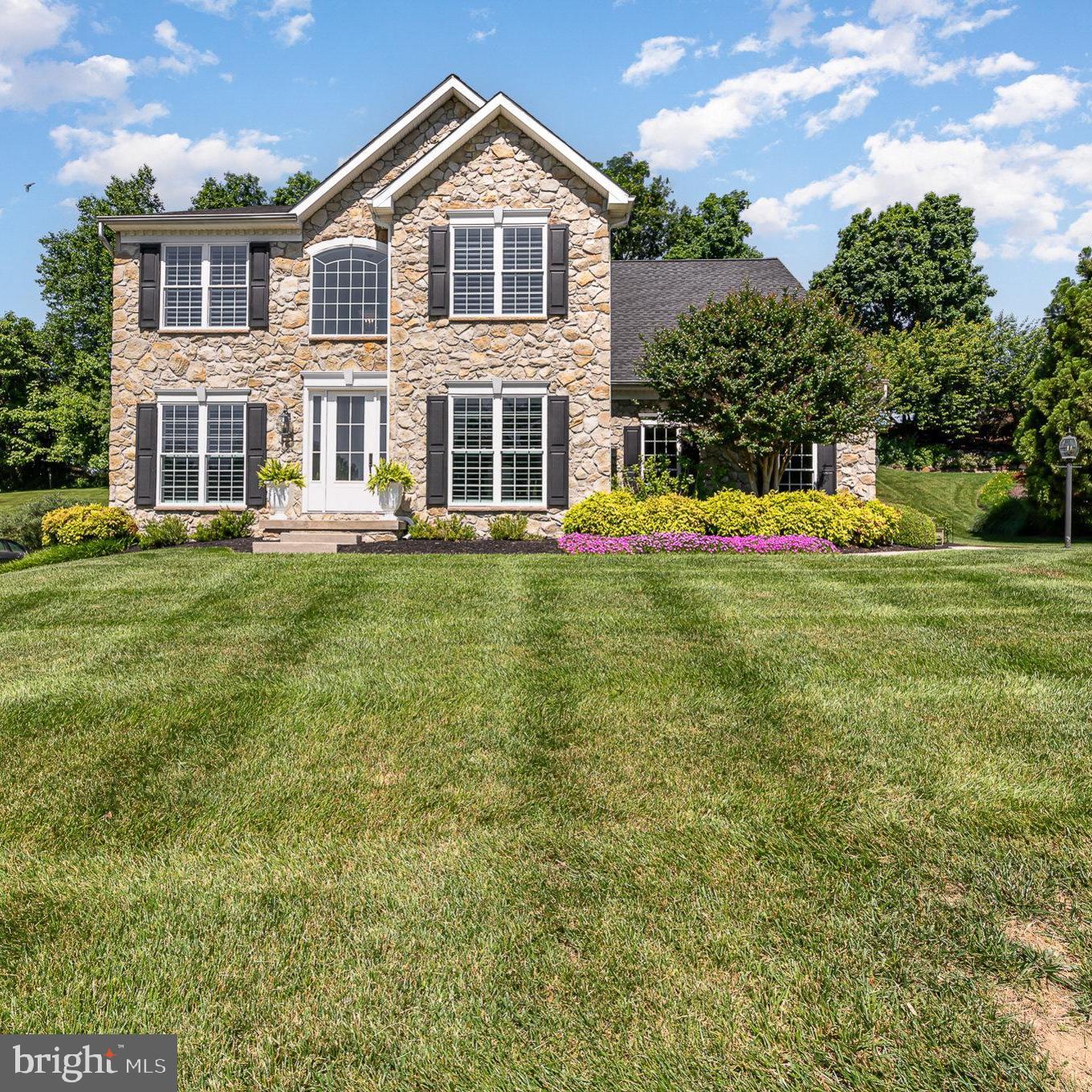 Welcome to 1932 Medallion Court, a meticulously-maintained colonial, situated in a quiet neighborhood feeding to Fallston schools. This home was professionally landscaped and has a an impressive outdoor living space with deck and patio with stacked stone surround. The property backs to protected land - buyer to verify. Just inside, you'll find beautiful hardwood flooring, plantation shutters, recessed lighting and moldings. The kitchen was renovated with Quartz counters (2022), GE Cafe stainless steel appliances, breakfast bar and white cabinets. It opens to the two-story family room with gas fireplace and view of the rear entertaining space. A home office is tucked away with french door entry and built-in shelving while an expansive sunroom provides a relaxing space and exit to the rear of the home. Upstairs, you'll find four bedrooms. One of the full bathrooms has access to the laundry. The primary bedroom has a cathedral ceiling, two walk-in closets and luxury bathroom with water closet, double sinks and frameless shower with separate soaking tub. The lower level awaits your finishing touches with plenty of open space. The home has a security system and some additional updates include roof (2021); Upper zone HVAC (2021); new patio door and hardwood stairs added.