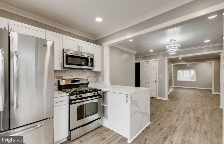 Make this GEM your New Home!!! 
Gorgeous renovated 4 Bedroom/1 Bath on a Large Corner Lot! This home boasts a beautifully fenced backyard. The Open floor plan on main level offers a large foyer area which leads to a spacious living room and separate dining room. A chef's dream in this gourmet kitchen with gorgeous quartz counters, stainless steel appliances, plenty of cabinet space, garden window in kitchen and sliders that lead to a huge back yard. Beautiful flooring throughout main level and 2 large bedrooms and custom tiled full bath. Upper level offers 2 additional bedrooms with plenty of closet space. Lower level can be used as a family/rec room or workout area. Basement kitchenette area offers tons of storage space. New HVAC and HWH, Private paved driveway and on street parking, large yard with corner patio area a great space for those summer cookouts, and recently seeded so when Spring arrives - a lovely green lawn! Just too many upgrades to mention so come take a tour.