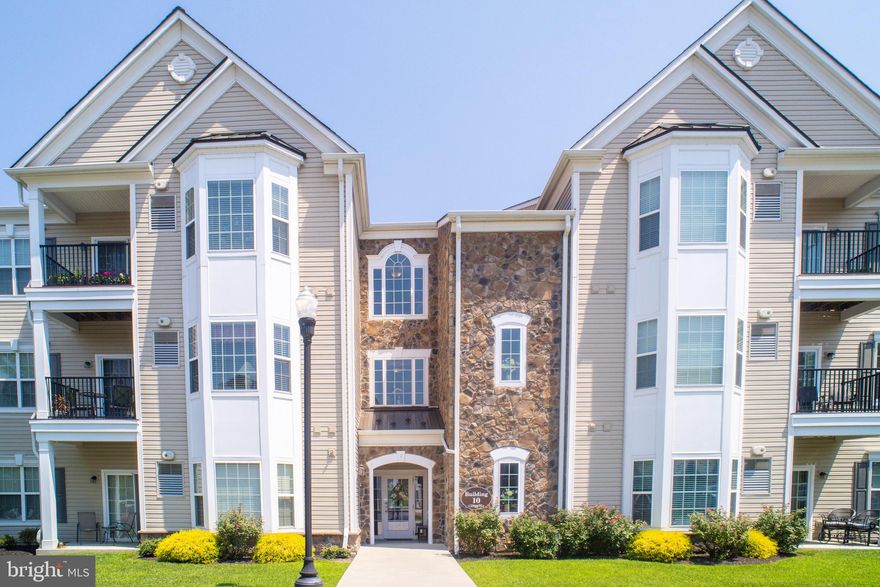 This beautiful ground floor condo is not to be missed! Traditions at Ridley Creek is regarded as a very desirable 55+ community. Enter the building through a spacious, cheerful, common area to this meticulously cared for unit. The welcoming foyer has a large storage closet with a hidden laundry area leading to an open floor plan.There is a cozy dining area and the kitchen features beautiful granite counter tops, contemporary tile back splash and 42" high cabinets, offering plenty of storage space. The large, comfortable living room has sliding doors to a private garden terrace. Here you can relax and enjoy the picturesque views of a tree lined creek as the seasons change. The master bedroom is amazing with its bumped out bay window creating a sitting area, two large closets and a full master shower bath with a linen closet. There is also a large, full bathroom off the hallway. A second bedroom is perfect for guests while the bonus room can be used for a den / office or a possible third bedroom (no closet). Embellishments consist of crown molding, wainscoting, 9' ceilings and an alarm system. Carpet in the master bedroom, living room, and hallway is only one year old. The unit has had the paint refreshed. The basement has dedicated storage space for the unit. It is obvious that the owners take great pride in this well kept condo and hope that you will decide to make this your next home.You will have access to the club house for entertaining, activities, and use of the exercise center. Living here you are conveniently located to shopping, restaurants, parks, hospitals, public transportation, airport, I-95 & I-476.