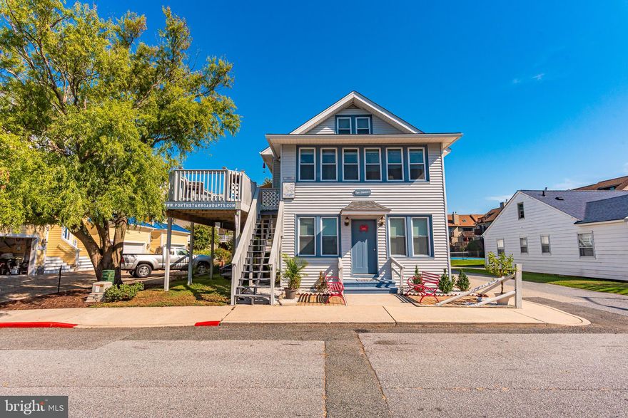 This well-maintained four-unit property offers updated systems, modern amenities, and excellent rental potential. Unit 1, located on the first floor at the front of the building, features three bedrooms—two with queen beds and one with a twin bed—along with a brand-new  gas tankless water heater, gas forced-air heat, and window unit air conditioning.  Unit 2 is a unique two-level layout connected by a spiral staircase, with a queen bedroom upstairs, kitchen on the lower level, electric baseboard heat, and window unit cooling. The owner’s Unit 4 occupies the second-floor front and boasts two queen bedrooms, a large side deck with an electric awning, an updated kitchen with stainless steel appliances, central air with a heat pump, and a new water heater installed in 2025. Unit 5, at the rear of the second floor, includes two queen bedrooms, baseboard heat, and window unit A/C, with private access via the east-side steps beside the two-car garage. The property provides six off-street parking spaces—alongside the building, in front of the garage, and beneath the west-side deck—plus additional street parking. Guests also enjoy access to two shared laundry rooms, and the building is supported by a roof replaced in 2014. This versatile setup makes the property appealing for both owner-occupants and investors seeking strong rental income.