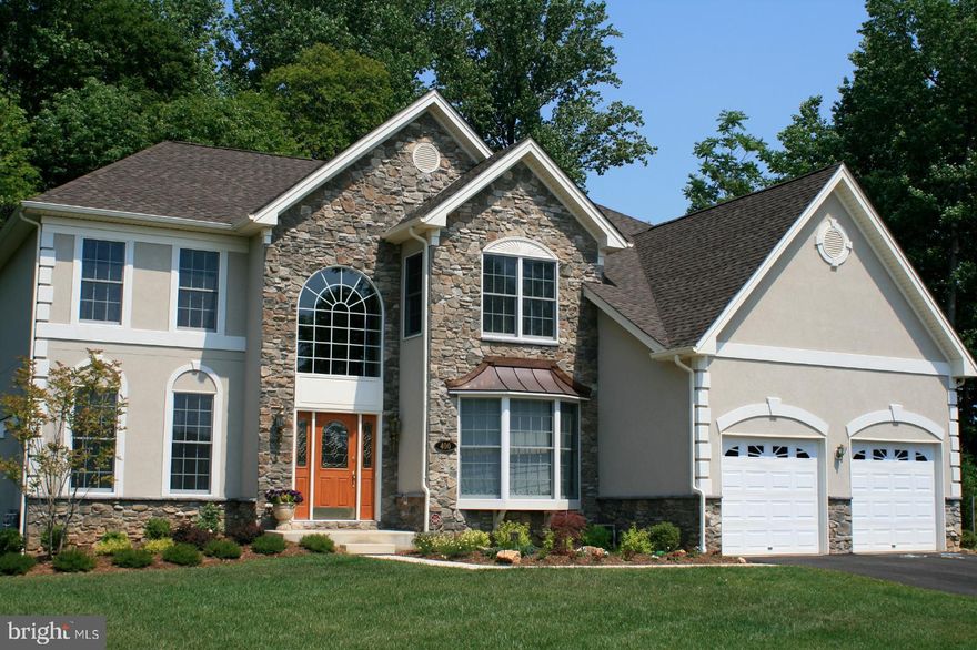 Nestled away in the highly desirable and serene enclave of Harford Green, this exquisite Colonial-style residence offers a harmonious blend of luxury and comfort, perfect for those seeking an elevated lifestyle. Spanning over 4,800 finished square feet, this meticulously maintained home boasts four spacious bedrooms and three and a half elegantly appointed bathrooms, ensuring ample space for relaxation and entertainment. This beautiful home is perfectly positioned at the end of a quiet cul-de-sac with a private backyard that backs to peaceful woods.

Step inside to a breathtaking two-story great room featuring floor-to-ceiling stonework, a dramatic fireplace, and spectacular views that bring the outdoors in. A second fireplace in the living room adds even more warmth and charm—ideal for cozy evenings or entertaining guests, and is perfect for unwinding after a long day.

The heart of the home is the gourmet kitchen, designed for both everyday living and hosting, complete with a generous center island and granite countertops. A spacious study with bay windows offers the perfect work-from-home space filled with natural light, while the main-floor powder room adds convenience for guests.

Upstairs, the primary suite is a true retreat, featuring a tray ceiling, a comfortable sitting area, and a massive walk-in closet. The deluxe primary bath feels spa-inspired with a soaking tub, separate shower, and dual vanities. Three additional bedrooms share a well-appointed hall bath, providing space and comfort for everyone.

The fully finished walkout level basement expands the home even further, offering a large rec room, a guest room, a full bathroom, and an impressive amount of storage.

Outside, enjoy the best of indoor-outdoor living with a large deck and patio, complete with a fire pit, all surrounded by serene wooded privacy. The outdoor space is perfect for hosting gatherings or simply enjoying the serene views where the tranquility of nature surrounds you. The location is unbeatable—featuring a path directly to the Emmorton Elementary School baseball field, and just a short walk to the Abingdon Library and the Bear Trail.

To top it off, this home includes an attached oversized 2 car garage equipped with an EV charging station, blending luxury with modern convenience, ensuring that your modern lifestyle is effortlessly accommodated.

This residence is not just a house; it's a place where memories are made, and a lifestyle of comfort and elegance awaits. Experience the perfect blend of luxury and nature in this stunning home, where every detail has been thoughtfully curated for your enjoyment.