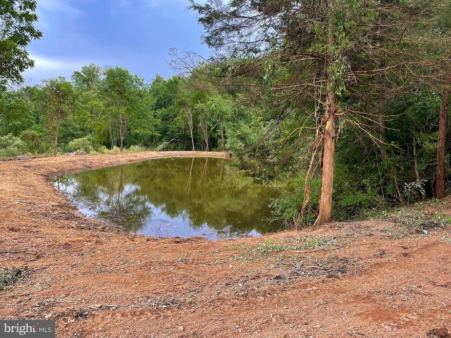 What a Beautiful Build Site! ..... Almost 12 acres of privacy with your own personal pond stocked with bass, sunfish and not sure if anything else.  All this at the end of the road and only minutes to US Route 50 and not much further to Winchester VA.  Live in the Hills of WV were taxes are lower yet work in VA where the income is higher.  (There is an old septic and well from a previous home being sold AS-IS.)
